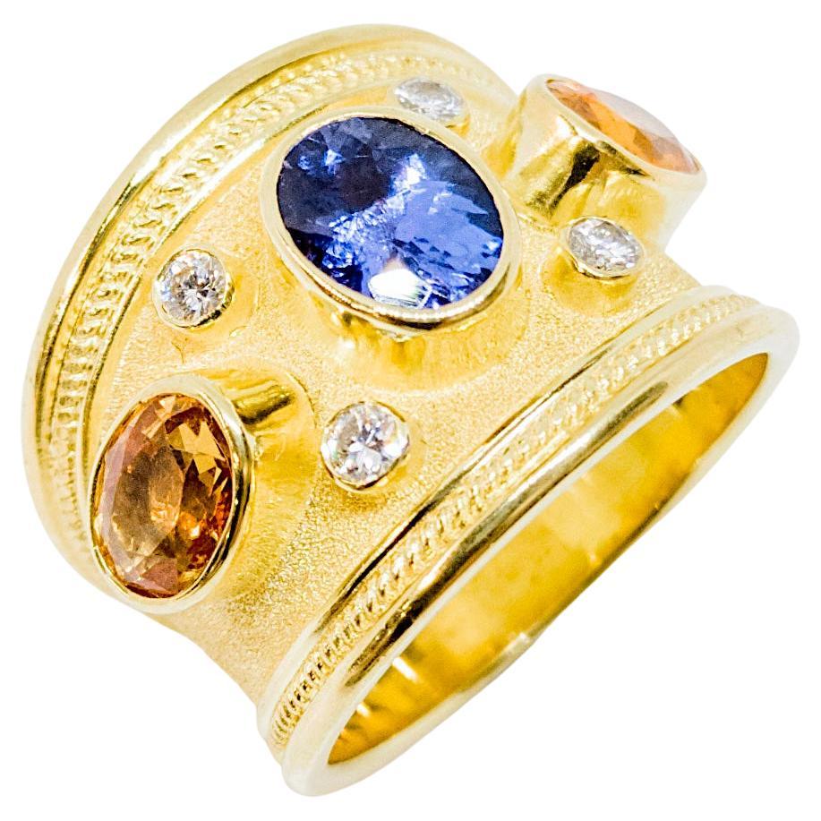 Georgios Kollektionen Ring aus 18 Karat Gelbgold mit Tansanit, Saphir und Diamant