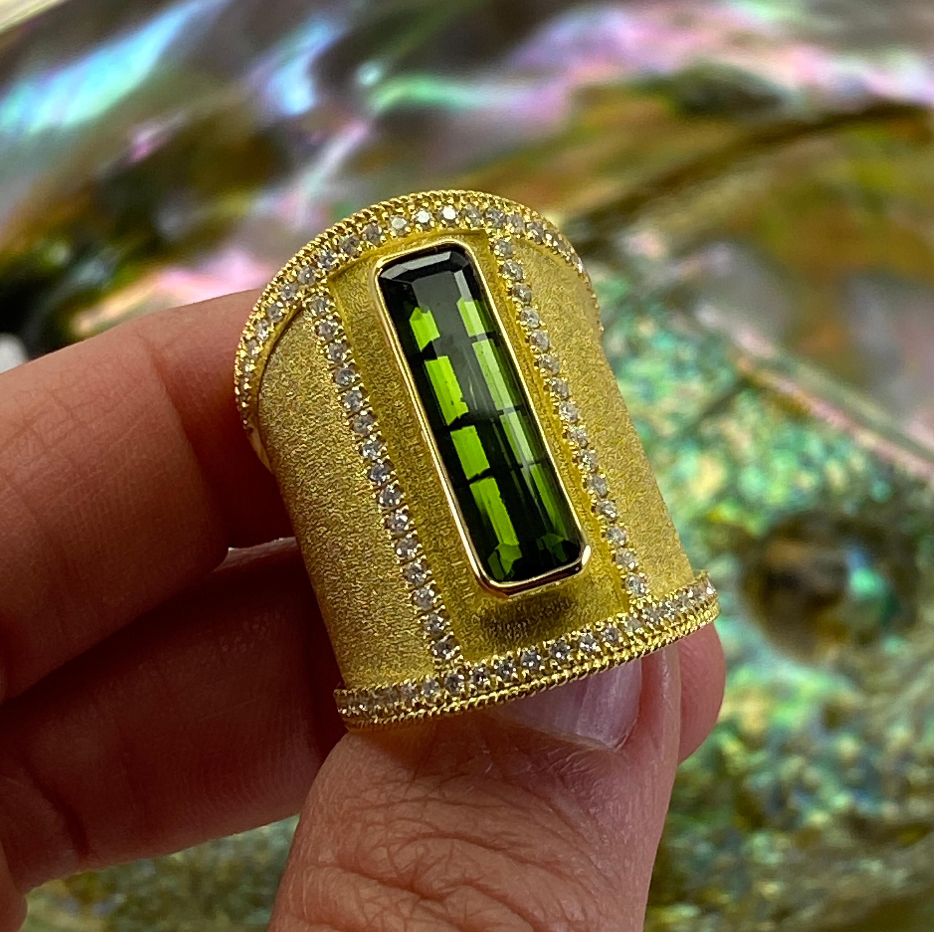 You are admiring S.Georgios designer 18 Karat Solid Yellow Gold Wide Ring all handmade in Byzantine style and a stunning unique velvet background. This gorgeous ring features a 4.35 Carat Green Tourmaline center and 0.74 Carats of Brilliant-cut