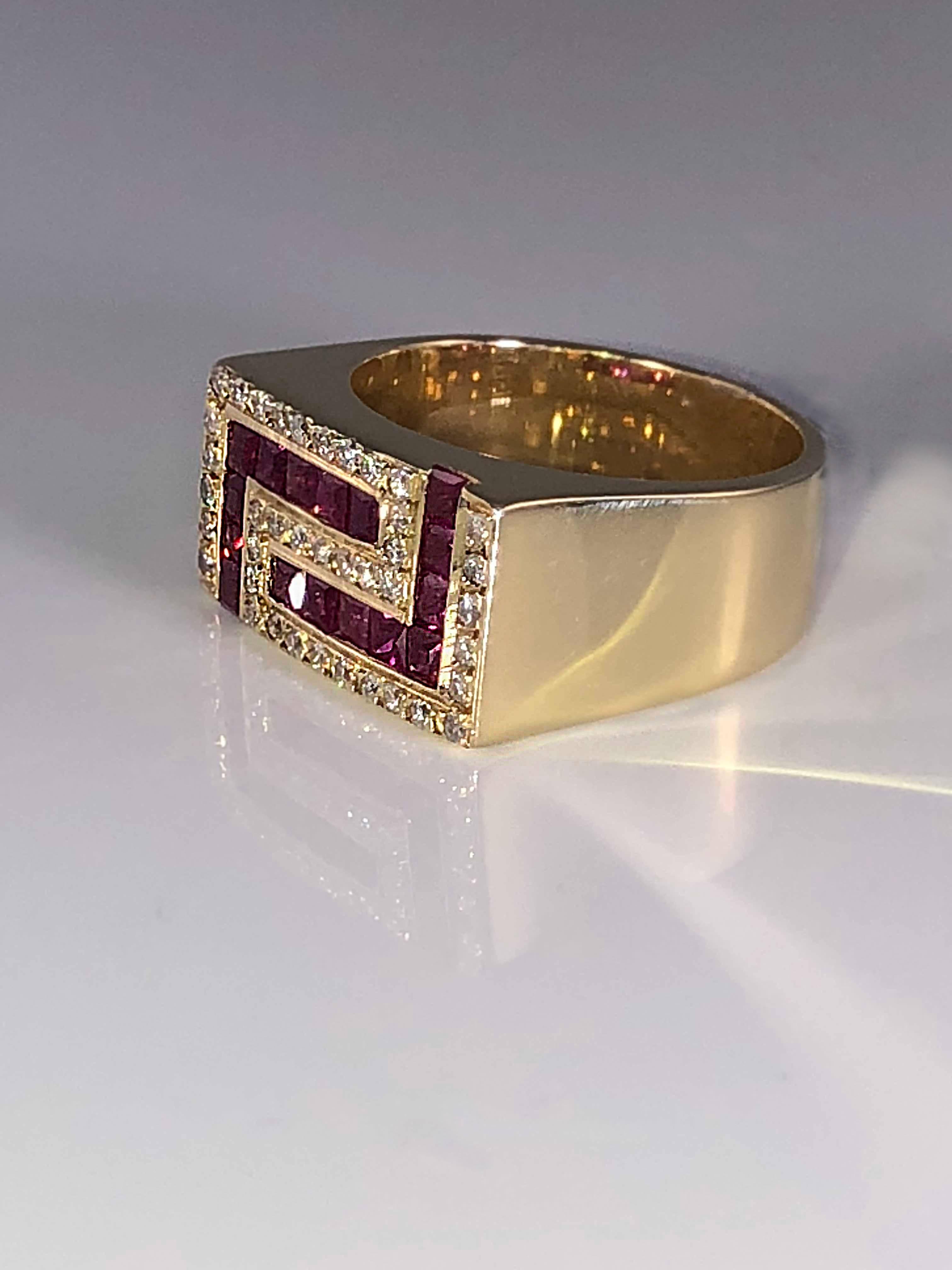 This beautiful men's or woman's S. Georgios ring is crafted from 18 Karat Yellow Gold and features the Greek Key design symbolizing eternity. White brilliant cut Diamonds with a total weight of 0.35 Carats are in contrast with Princess cut rubies