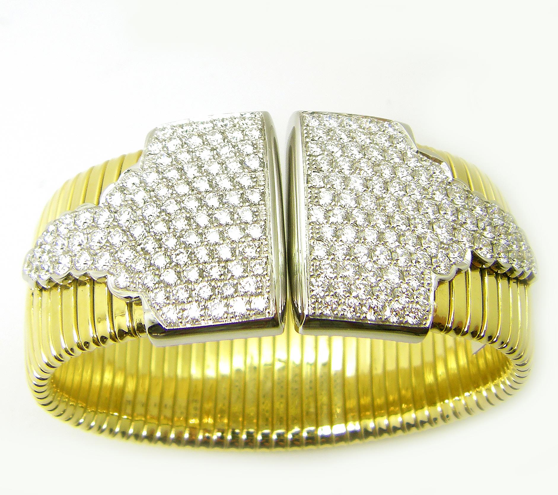S.Georgios designer two-tone flexible wide bangle bracelet in solid yellow and white gold 18 karats and is made by links connected together to give it the ability to stretch and feel unbelievably comfortable. This gorgeous cuff bracelet is custom