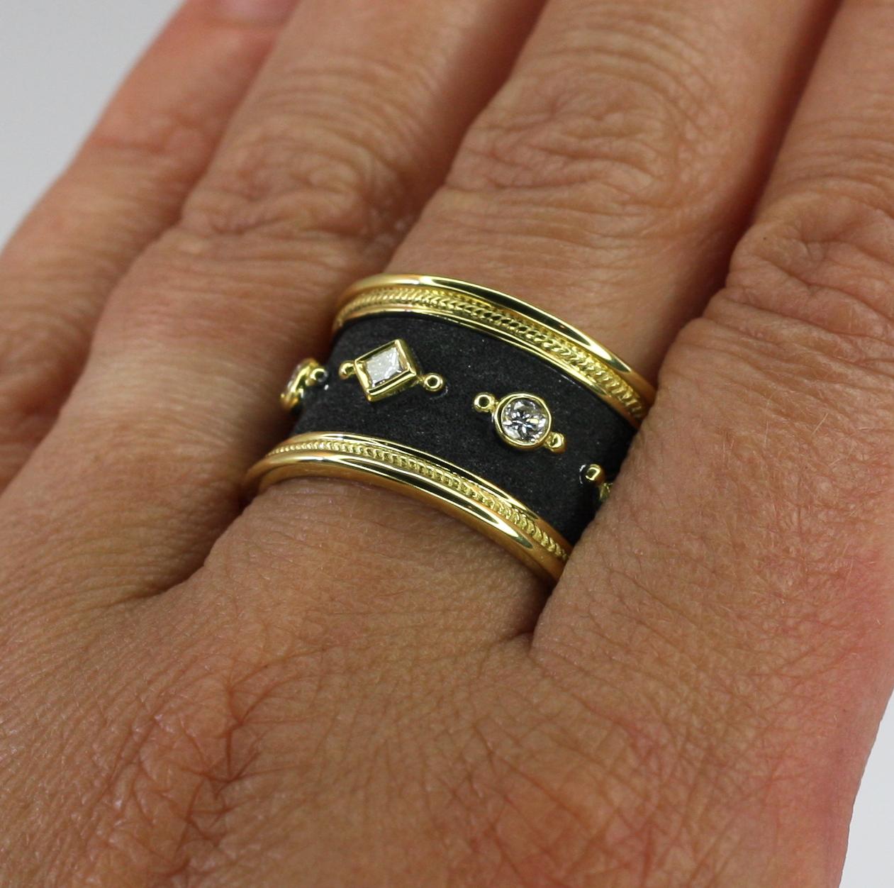 S.Georgios designer eternity band ring is all handmade from solid 18 Karat yellow gold and microscopically decorated all the way around with gold beads and wires. The unique velvet background is finished with black rhodium which created a perfect