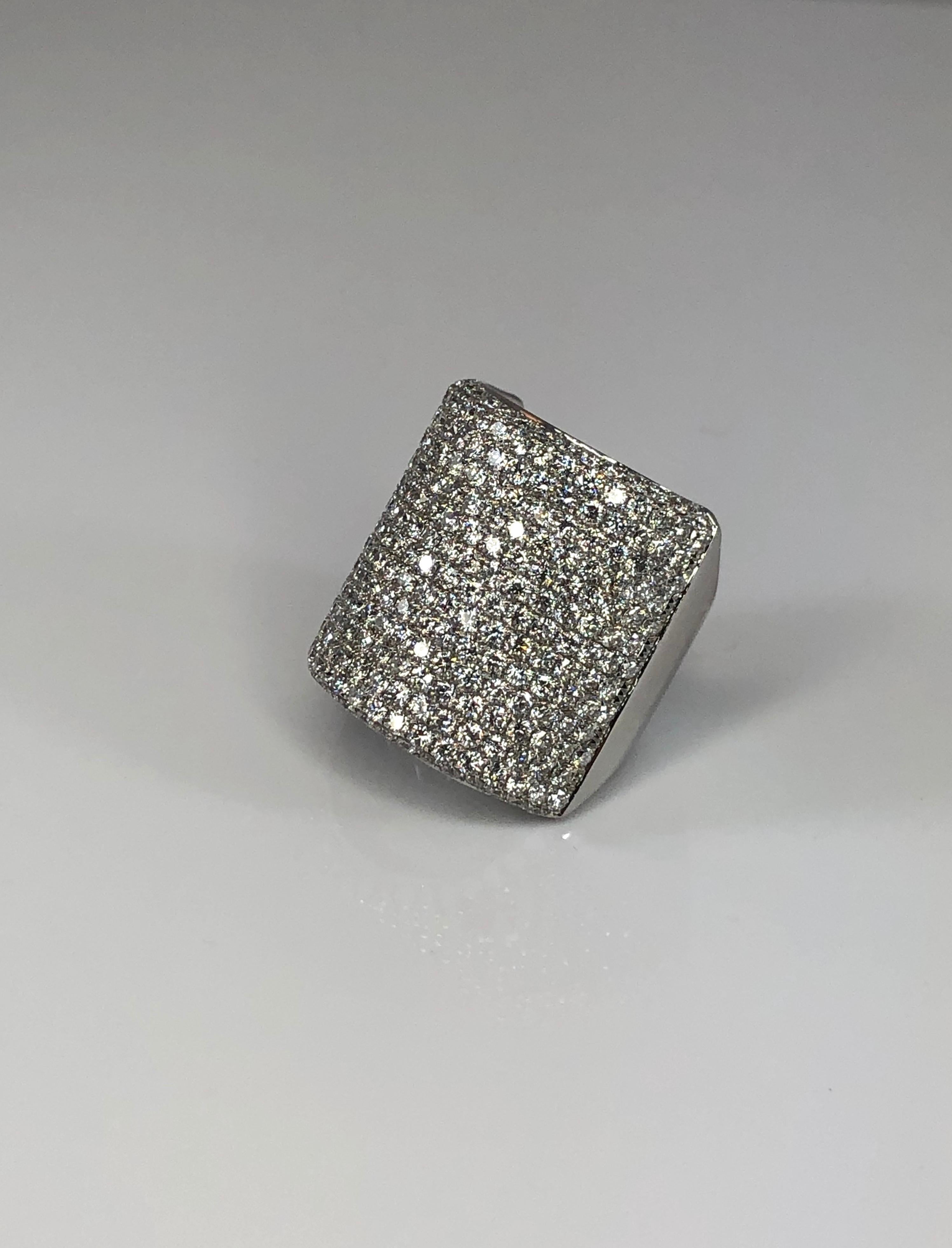 S.Georgios designer wide band ring is handmade from 18 Karat White gold in Athens Greece and features a total weight of 5.20 Carat microscopically set brilliant-cut White Diamonds. 
Size: 7 (can be custom adjusted to the desired size)
Weight: 11
