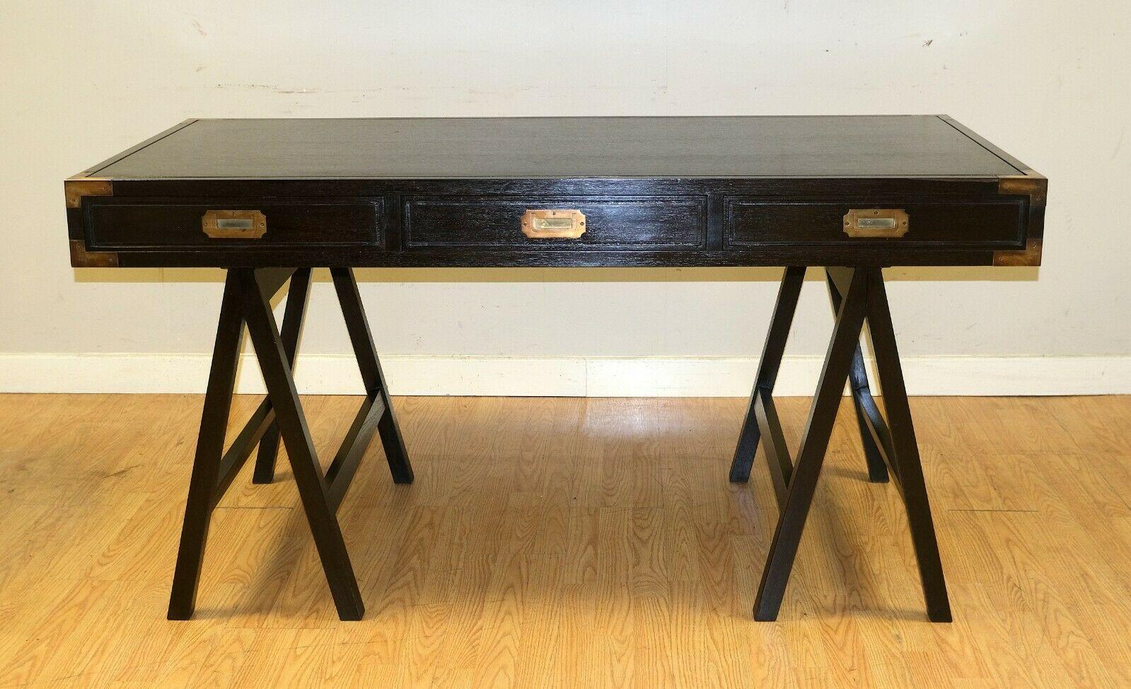 We are delighted to offer for sale this gorgeous Military Campaign Trestle mahogany brown desk with three drawers.

This well made, solid, and good-looking desk offers style with a lovely rich brown colour. It has three good size drawers with