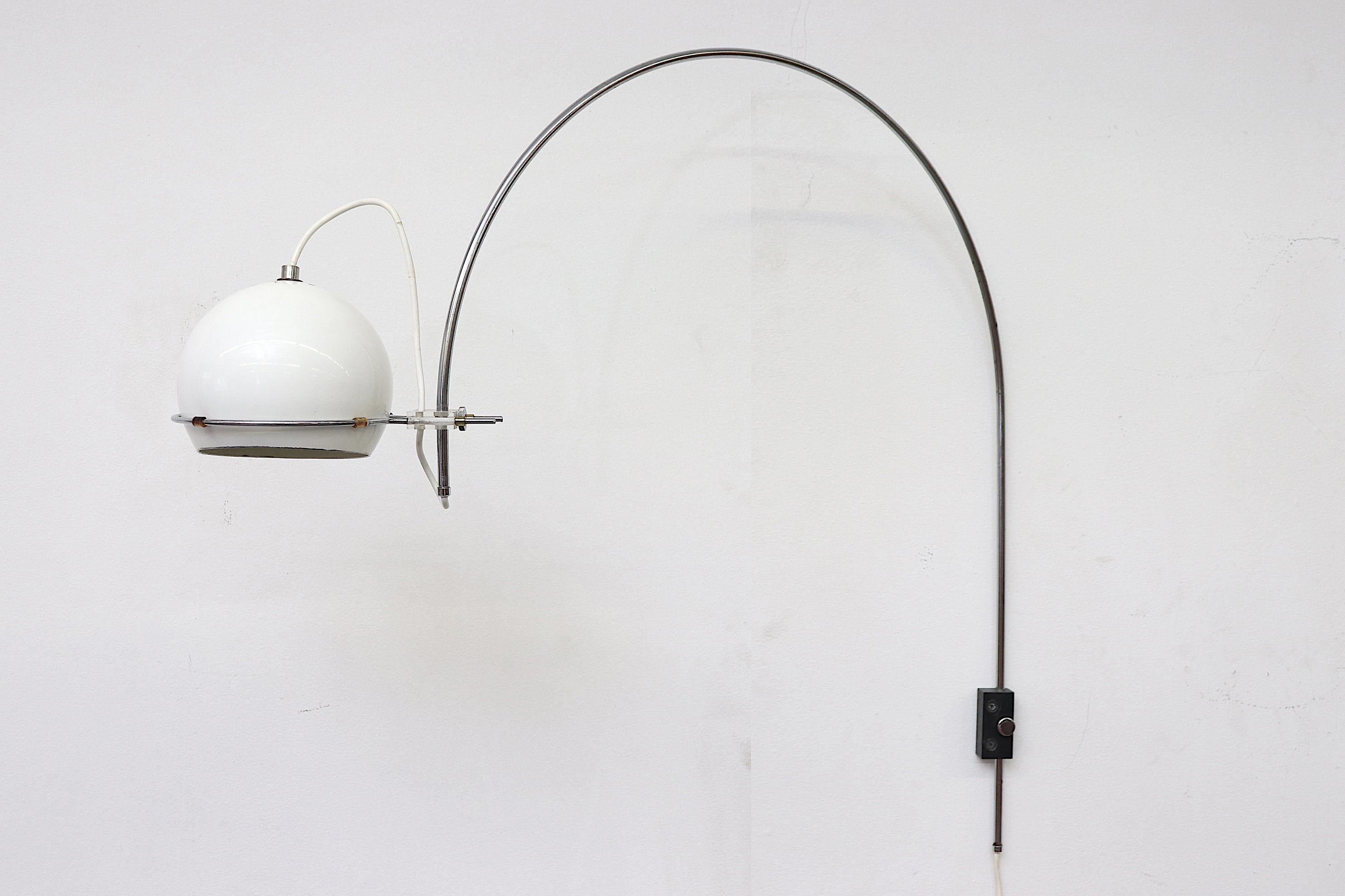 1970s midcentury chrome Gepo arc wall lamp with white enameled metal globe shade with chrome stem and acrylic accents. Original condition with visible scratching. Wear is consistent with its age and use. Similar styles available listed separately .