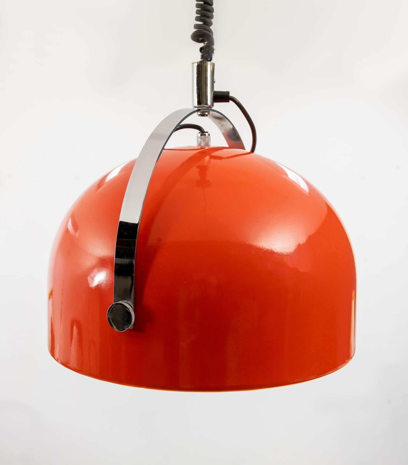 Gepo Amsterdam Design by Gebr Postuma Pendant lamp, comes with pull down coil spring. Stops at the height you wanted. 83 cm / 160 cm
works perfectly. Bright orange color. Also rotatable. So 1970s.
