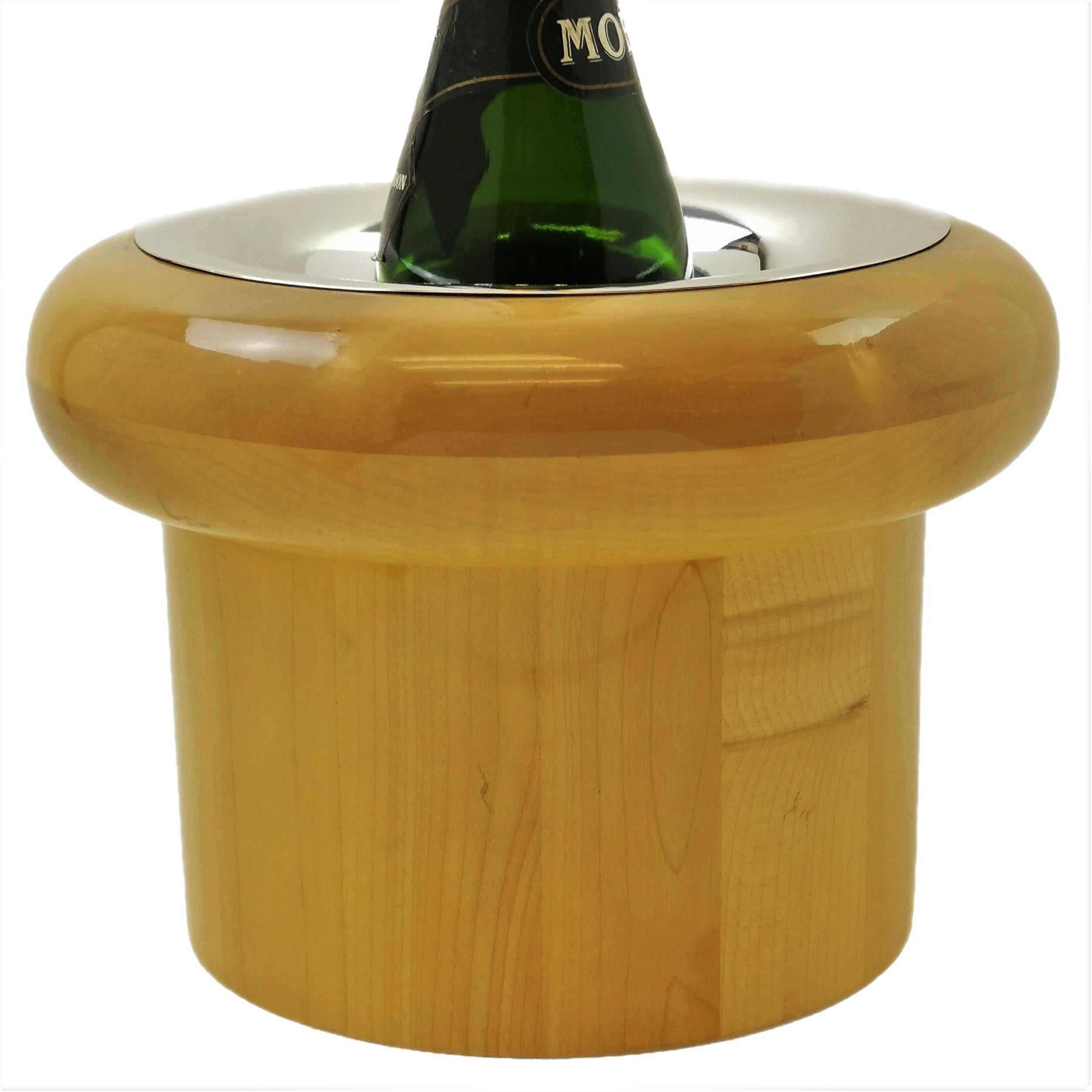 A magnificent modern English Sterling Silver and light wood Wine / Champagne Cooler by noted Silversmith Gerald Benney. The body of the Wine Cooler is a striking light wood and the rim and interior of the Cooler are created in solid silver.
The Wine