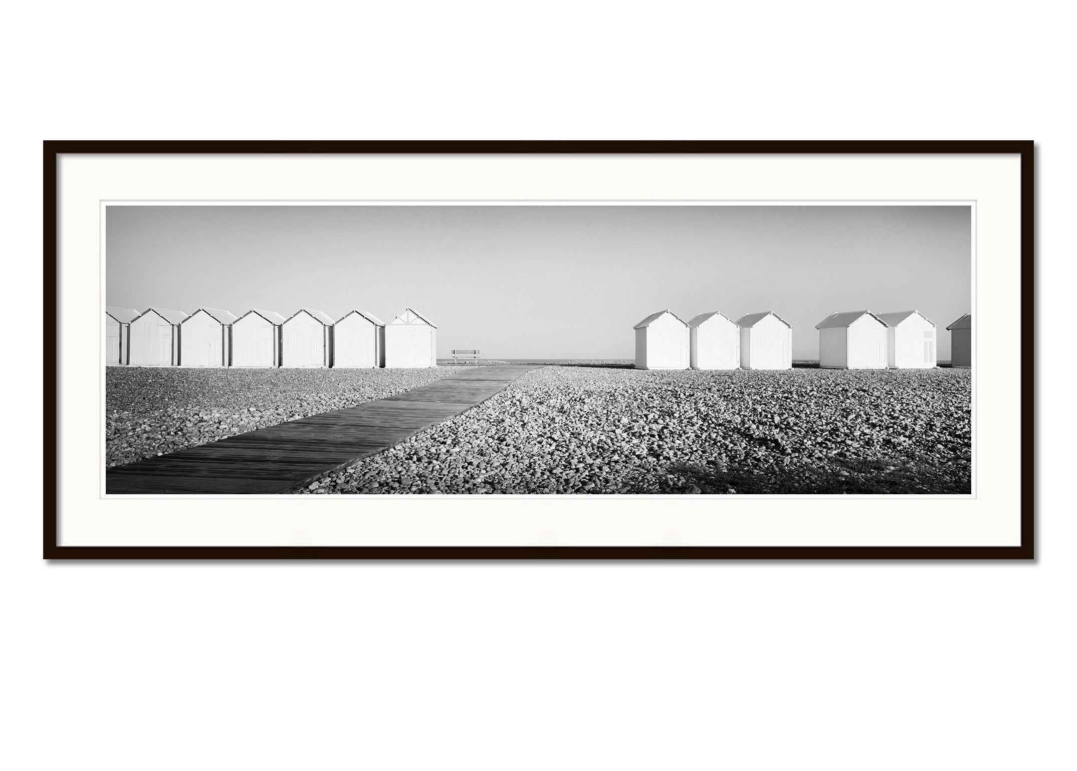 Beach Huts Panorama, bench, stones, France, black & white landscape photography - Gray Landscape Photograph by Gerald Berghammer
