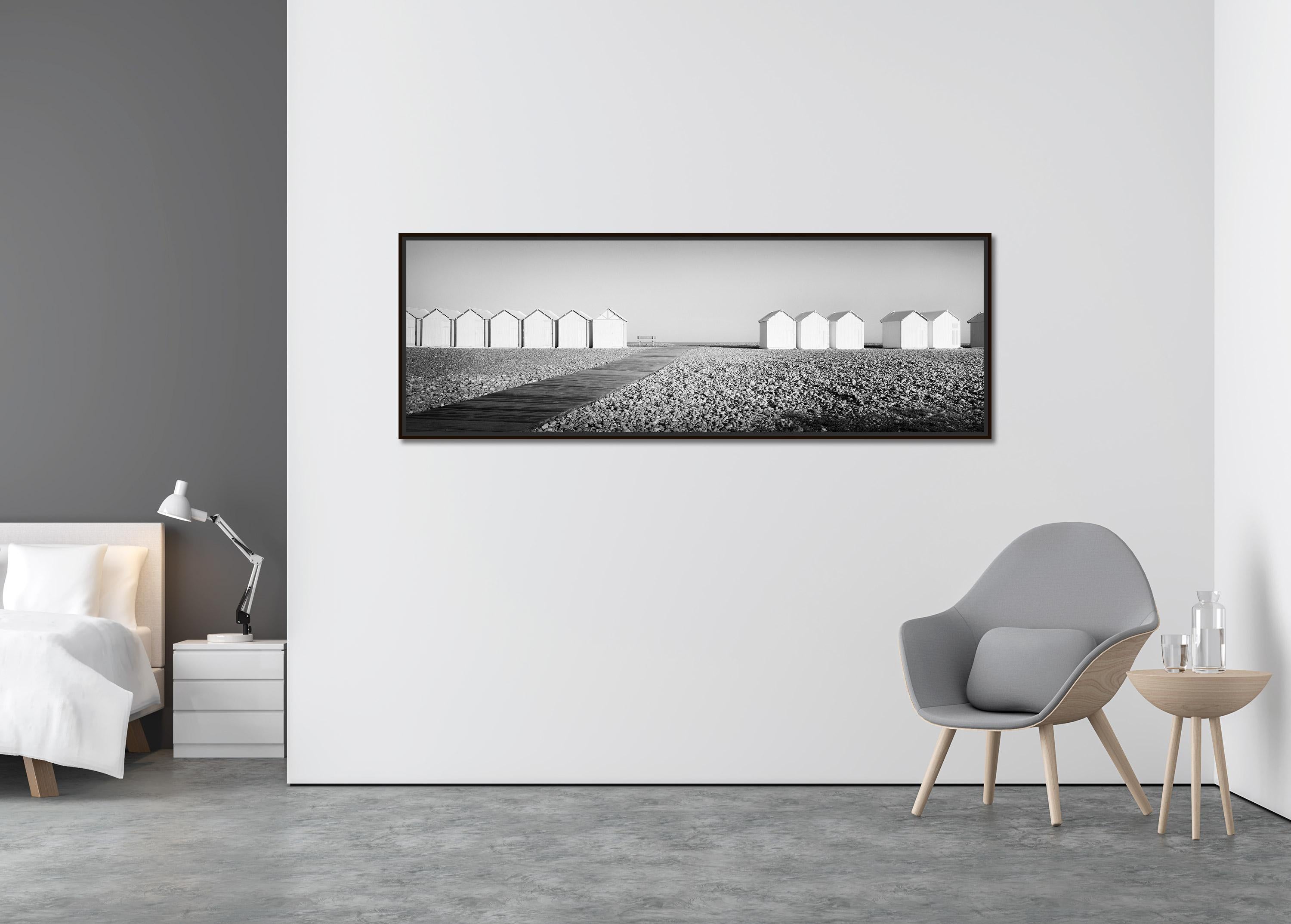Beach Huts Panorama, bench, stones, France, black & white landscape photography - Contemporary Photograph by Gerald Berghammer