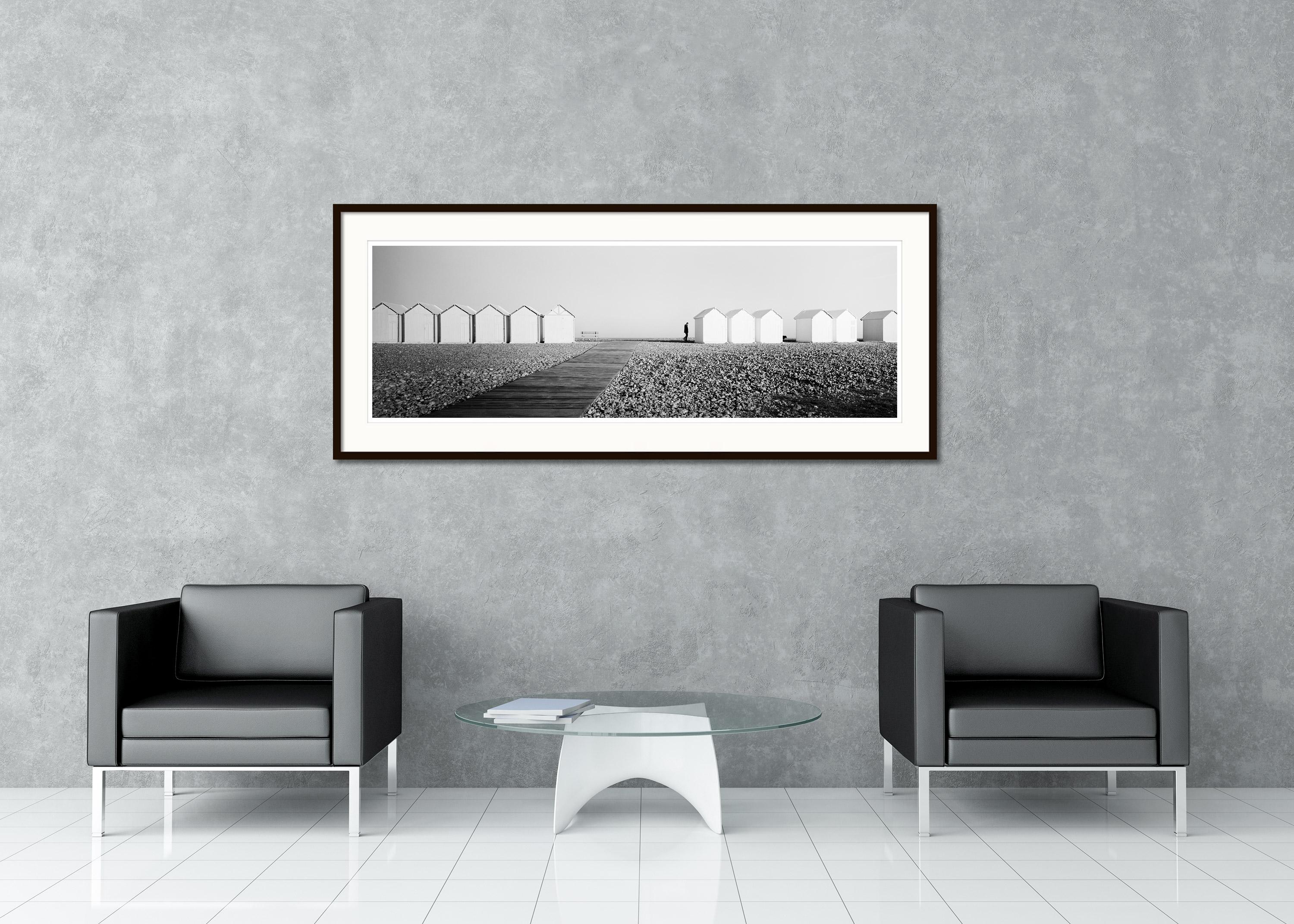 Black and White Fine Art panorama photography. Stone beach with beach huts and a walk with the dog, France. Archival pigment ink print, edition of 9. Signed, titled, dated and numbered by artist. Certificate of authenticity included. Printed with