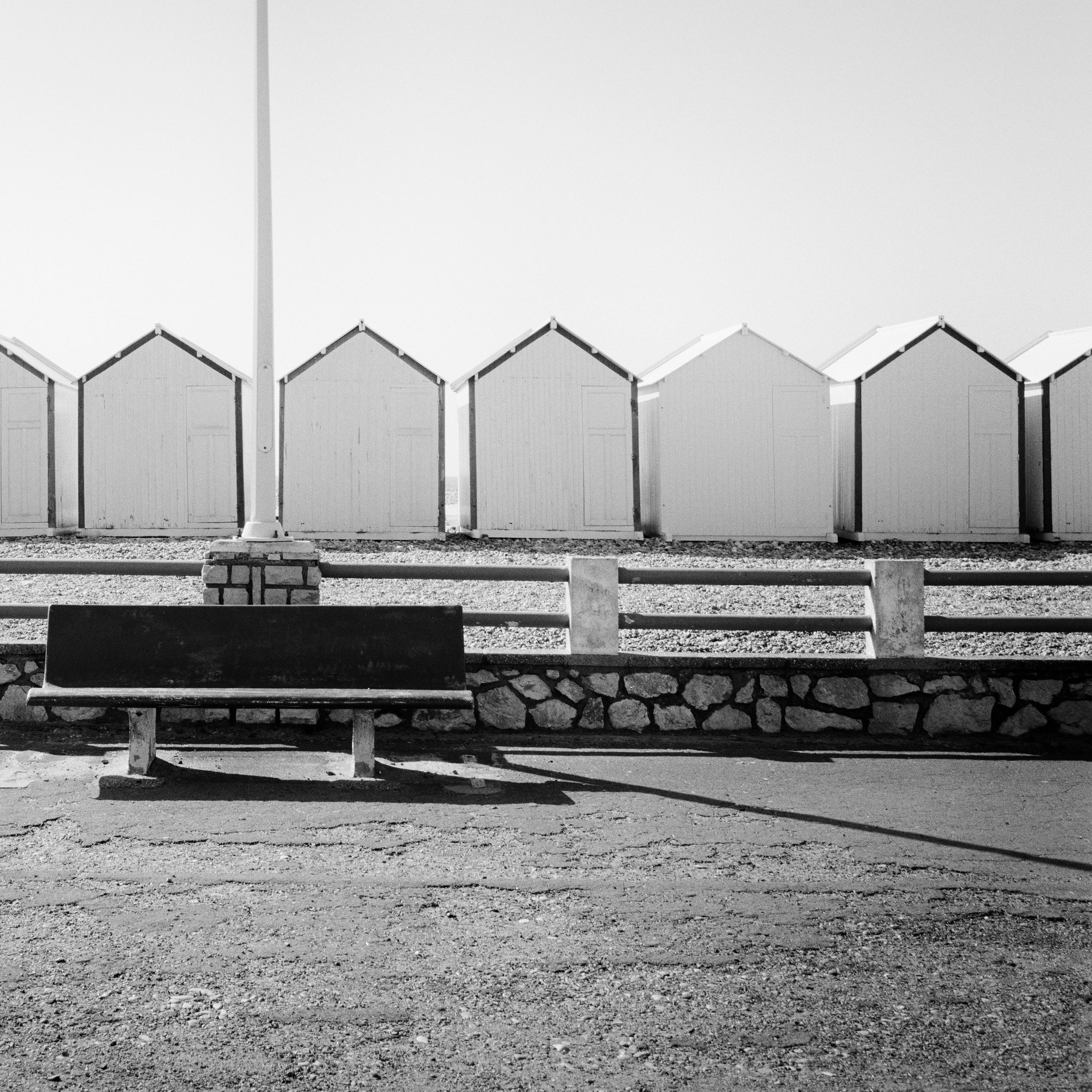 Bench on the Promenade beach huts France black white landscape art photography For Sale 4