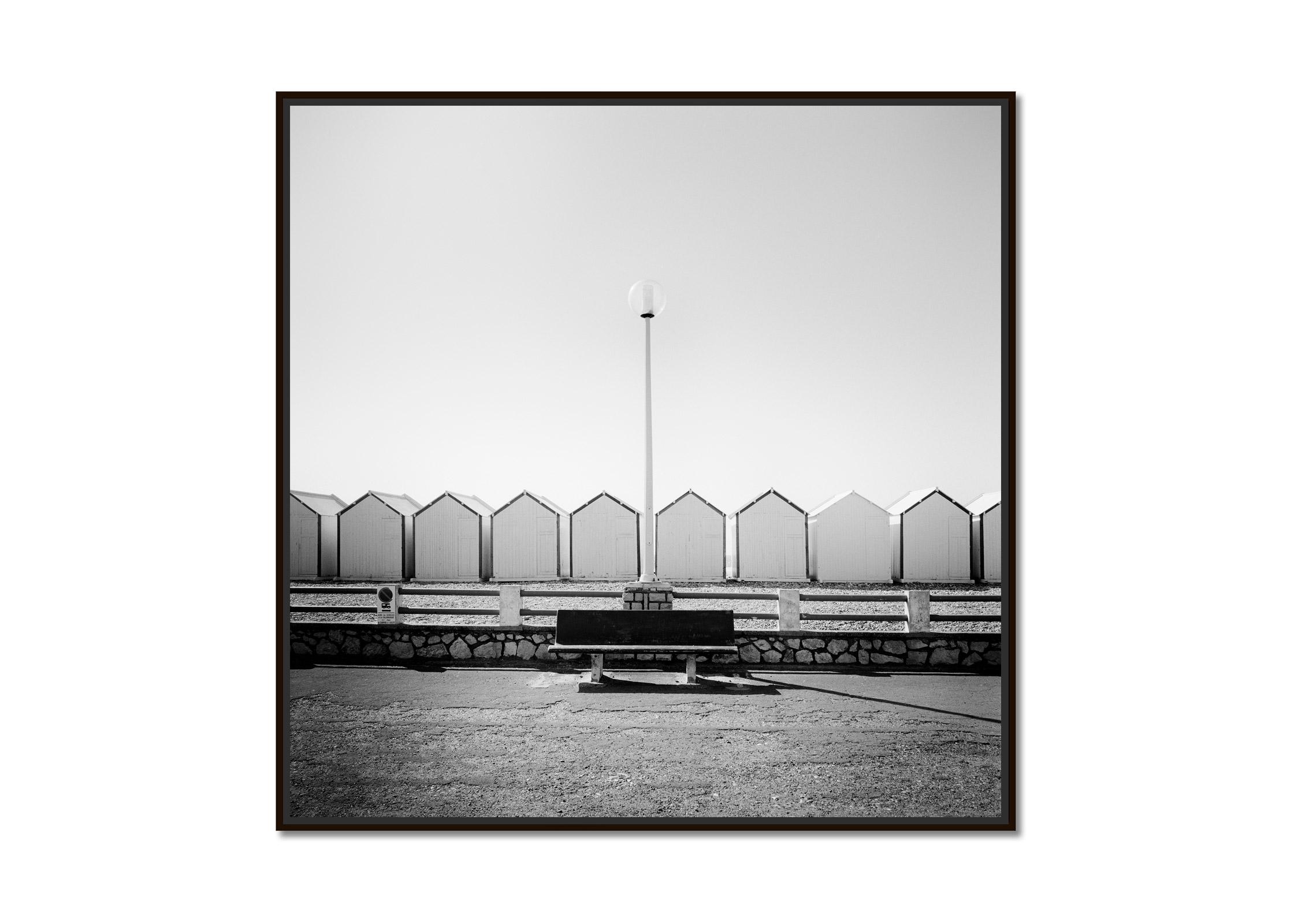 Bench on the Promenade beach huts France black white landscape art photography - Photograph by Gerald Berghammer