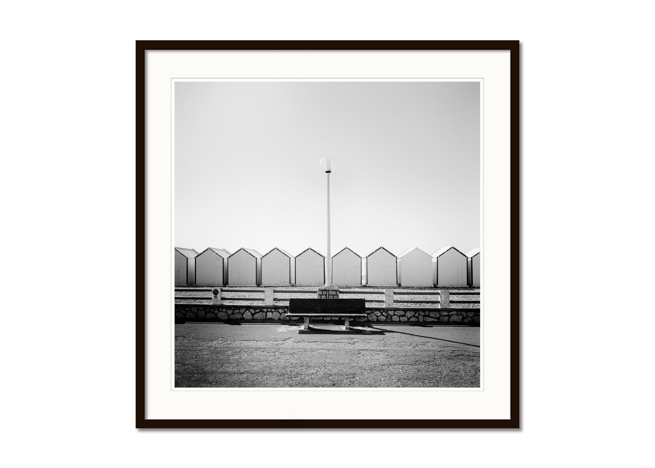Bench on the Promenade beach huts France black white landscape art photography - Contemporary Photograph by Gerald Berghammer
