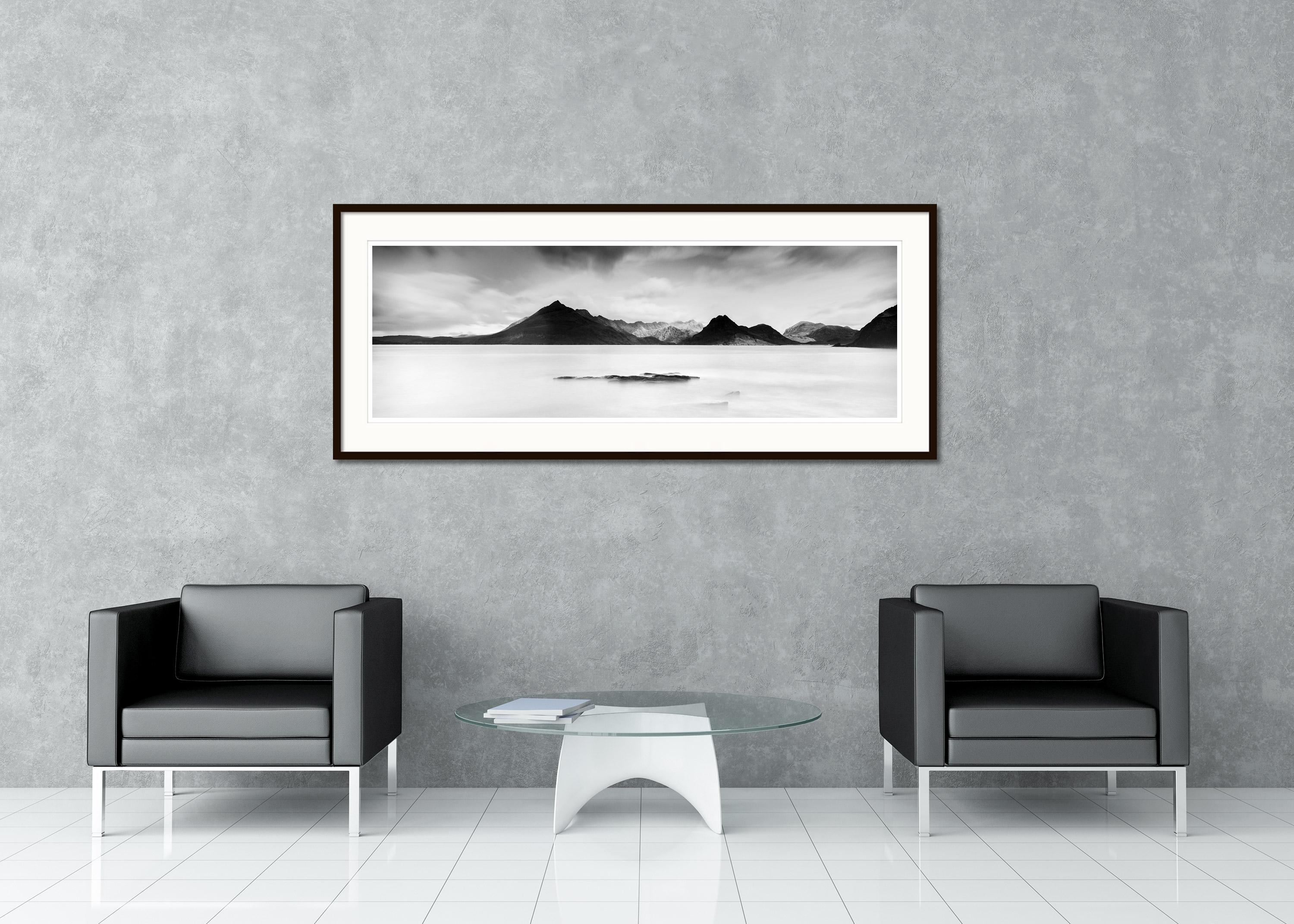 Black and white fine art long exposure waterscape - landscape photography. Wild Atlantic coast of Scotland with the big mountains in the background. Archival pigment ink print, edition of 20. Signed, titled, dated and numbered by artist. Certificate