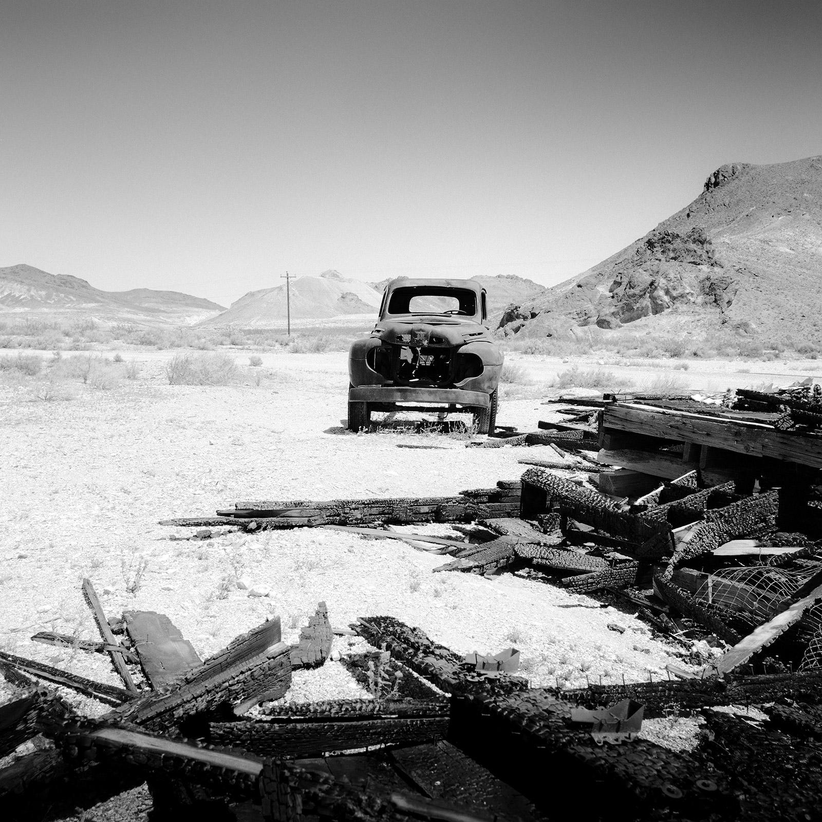 Gerald Berghammer Landscape Photograph - Burnt Down, Old US Car, California, black and white photography, art landscape