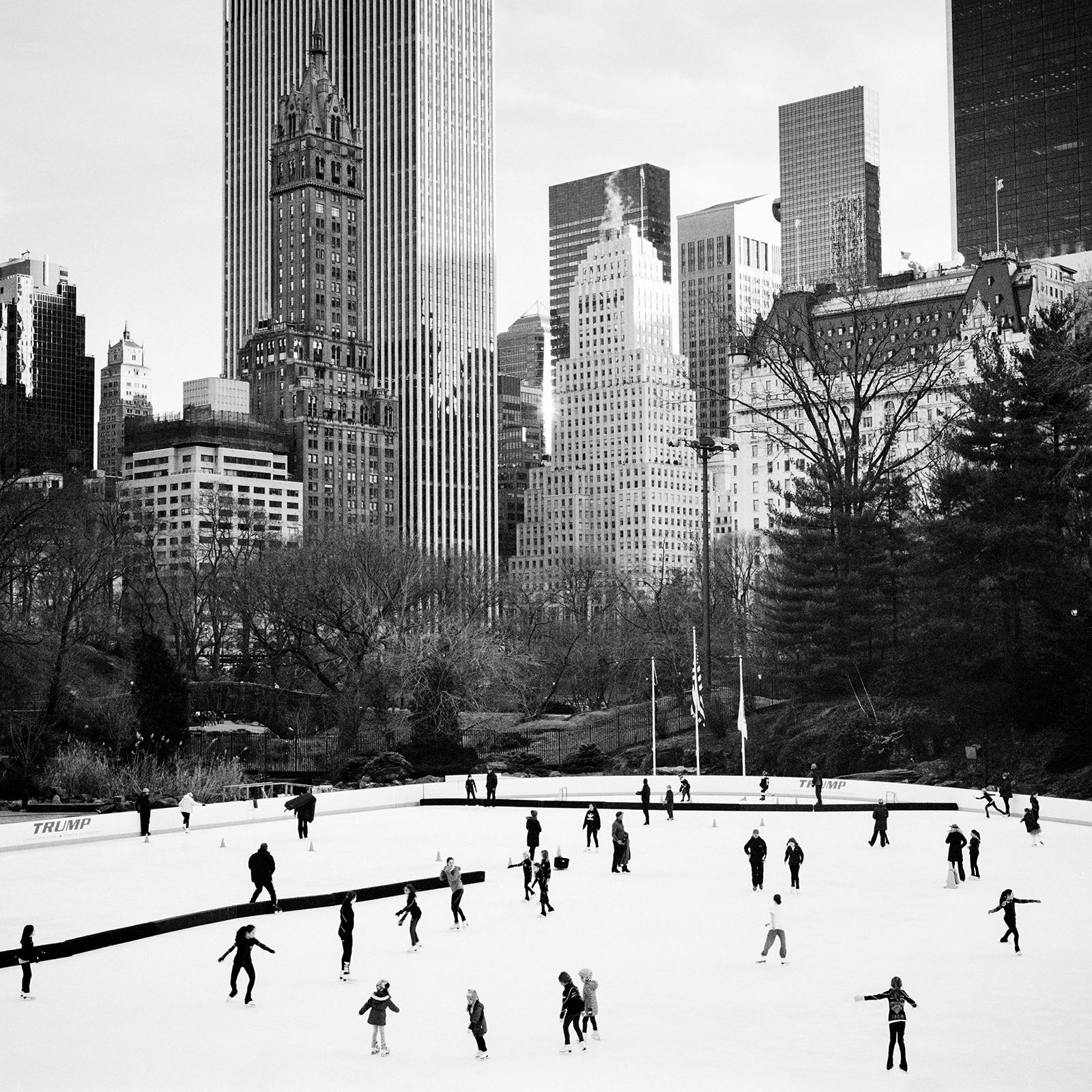 Black and white fine art cityscape - landscape photography. Ice Skating, Central Park, New York City, USA. Archival pigment ink print, edition of 9. Signed, titled, dated and numbered by artist. Certificate of authenticity included. Printed with 4cm