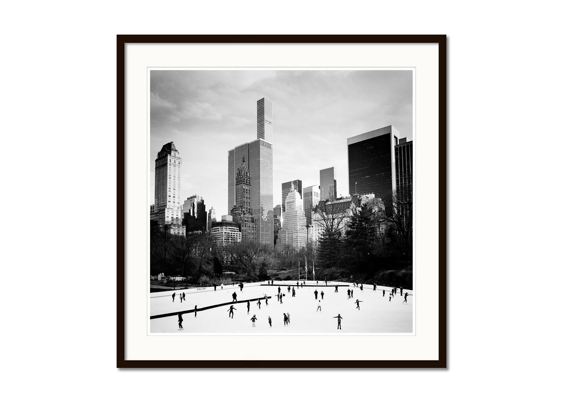 Black and white fine art cityscape - landscape photography. Ice Skating, Central Park, New York City, USA. Archival pigment ink print, edition of 9. Signed, titled, dated and numbered by artist. Certificate of authenticity included. Printed with 4cm