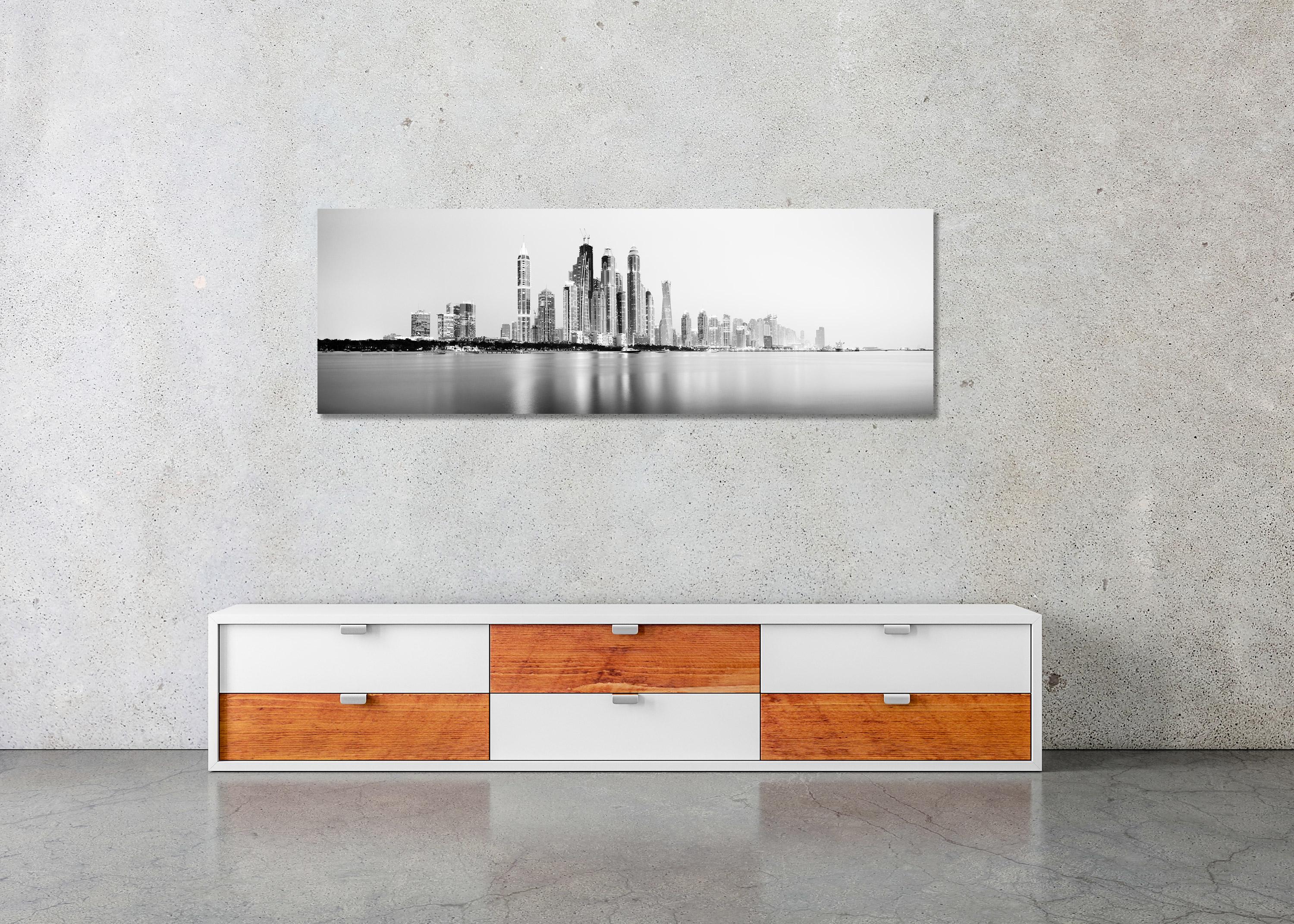 Black and White Fine Art Cityscape, Waterscape Panorama Photography - Dubai marina in the blue hour with the impressive skyscrapers and the beautiful beach. Archival pigment ink print, edition of 9. Signed, titled, dated and numbered by artist.