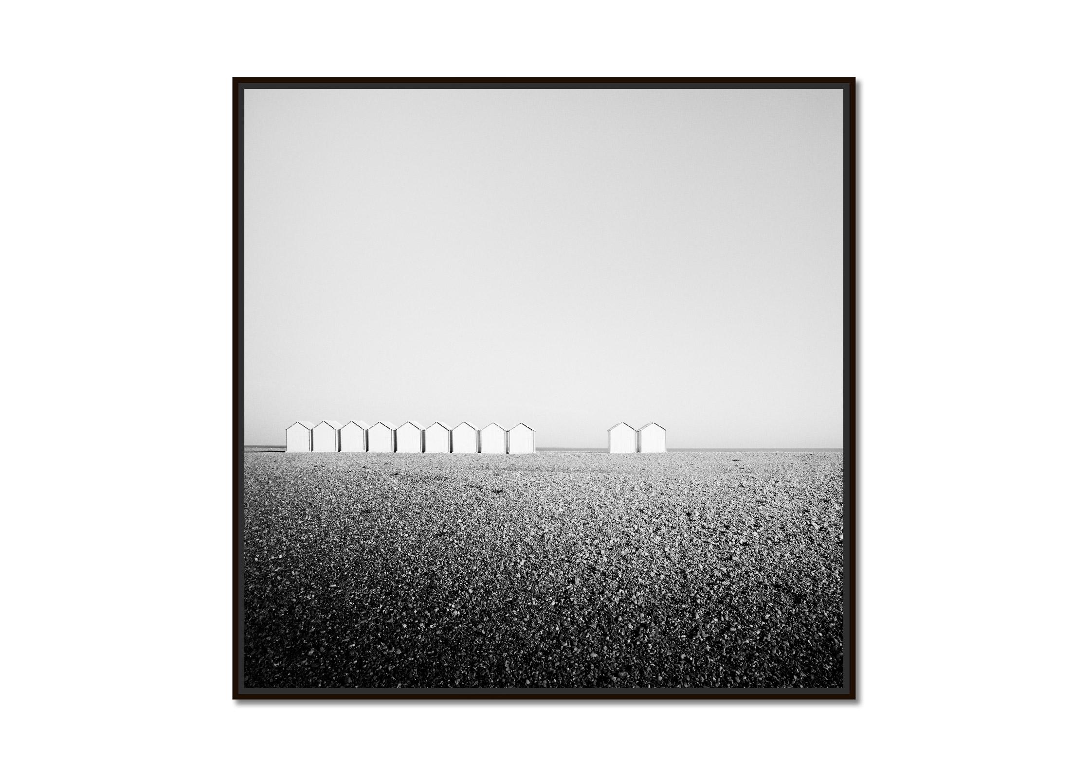 Eleven Huts, rocky beach, France, black and white fine art photography landscape - Photograph by Gerald Berghammer