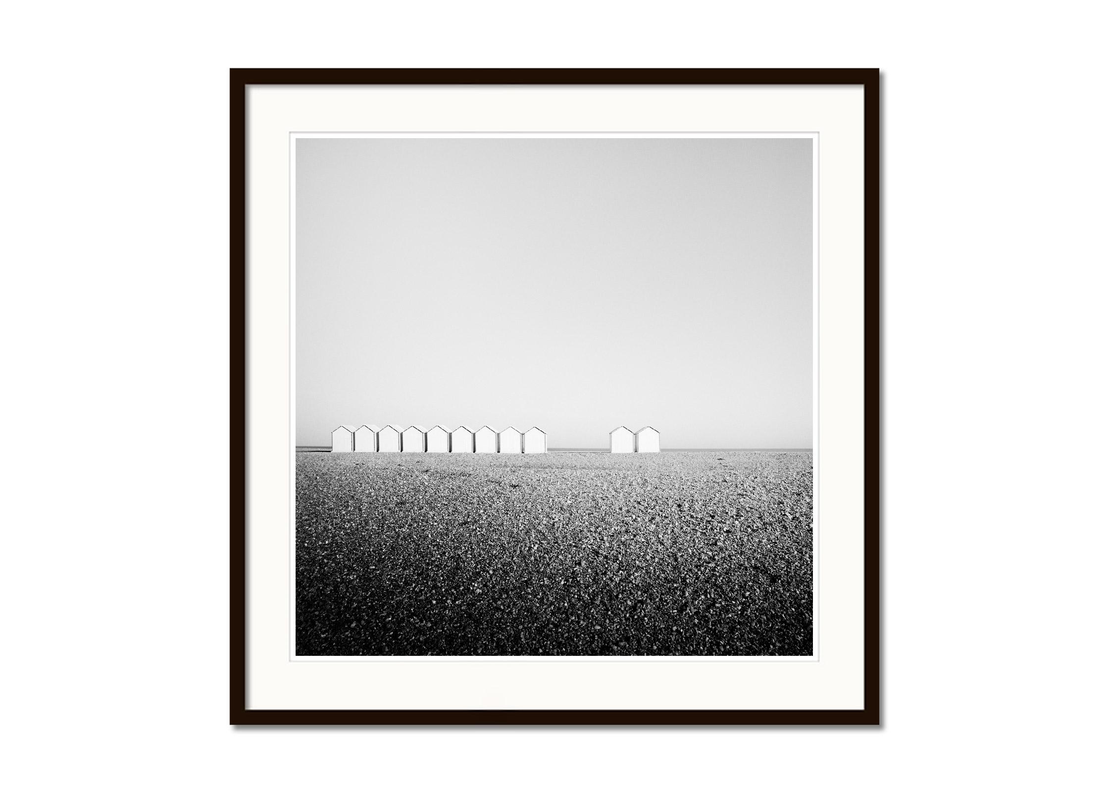 Eleven Huts, rocky beach, France, black and white fine art photography landscape - Gray Landscape Photograph by Gerald Berghammer