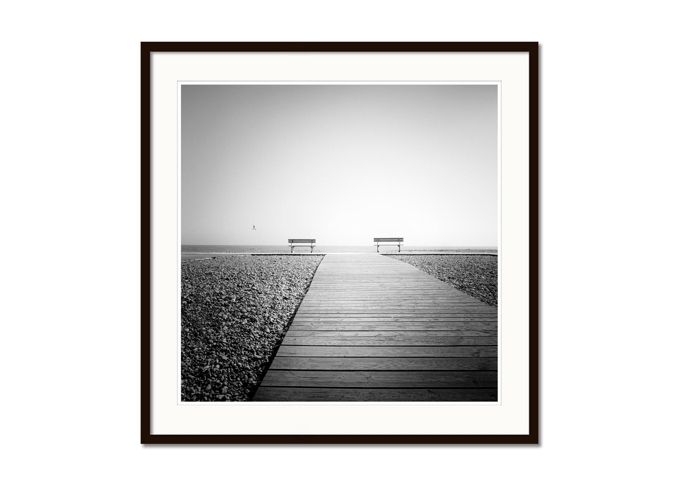 Esplanade, lonely rocky beach, France, Black and White landscape art photography - Gray Black and White Photograph by Gerald Berghammer