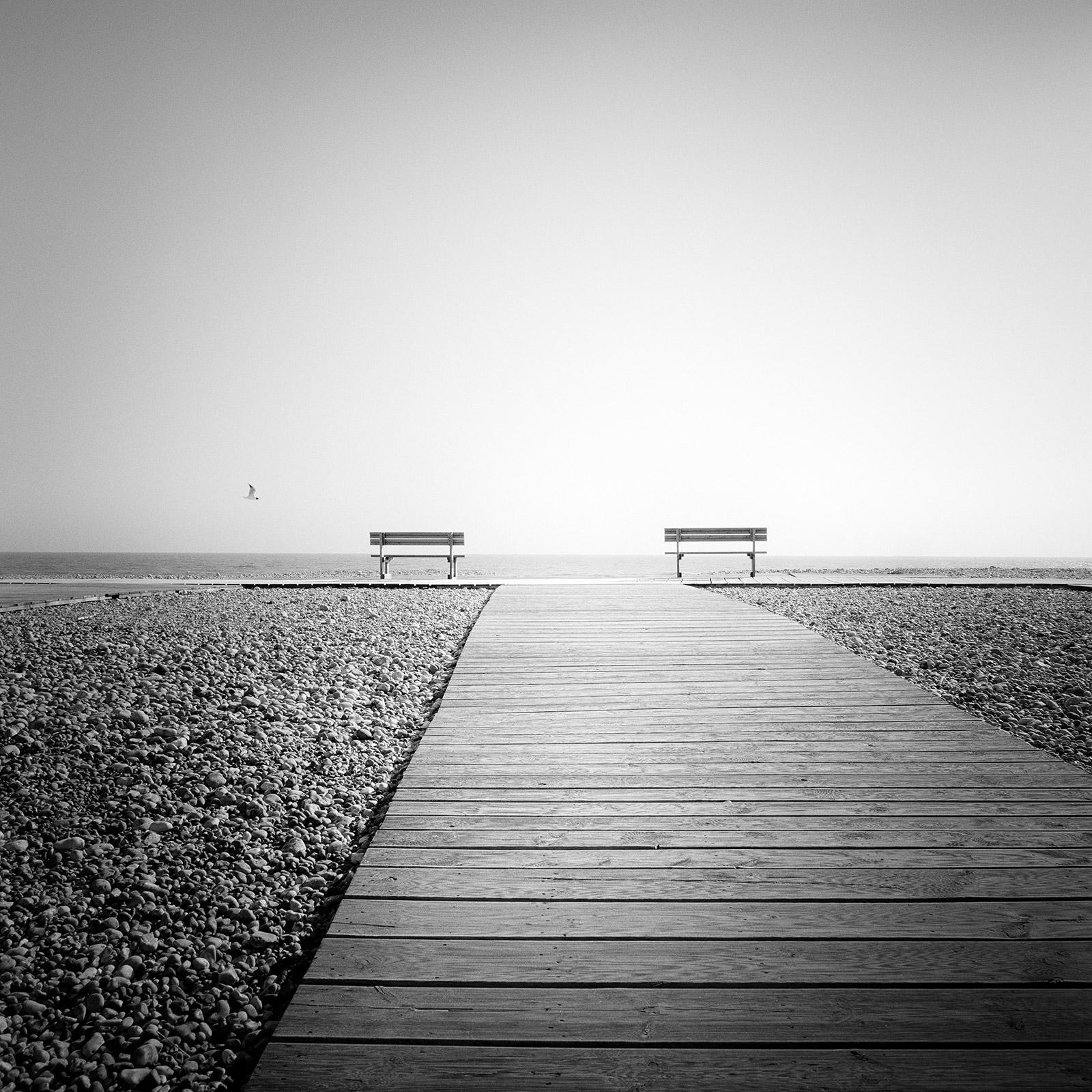 Gerald Berghammer Black and White Photograph - Esplanade, lonely rocky beach, France, Black and White landscape art photography
