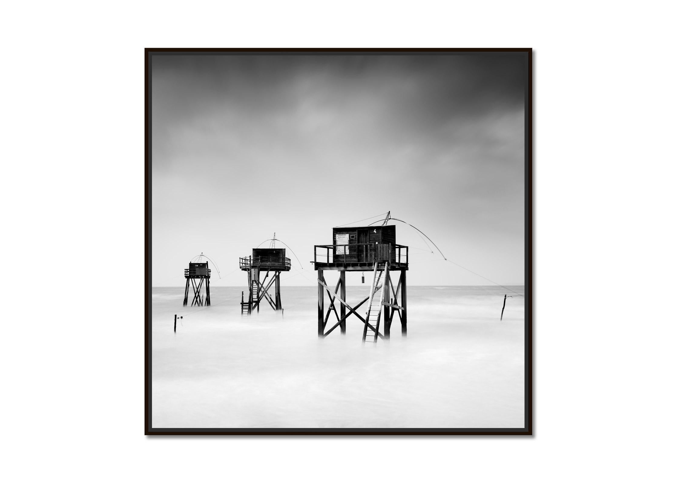 Fishing Hut on Stilts, atlantic coast, France, black and white landscape photo - Photograph by Gerald Berghammer