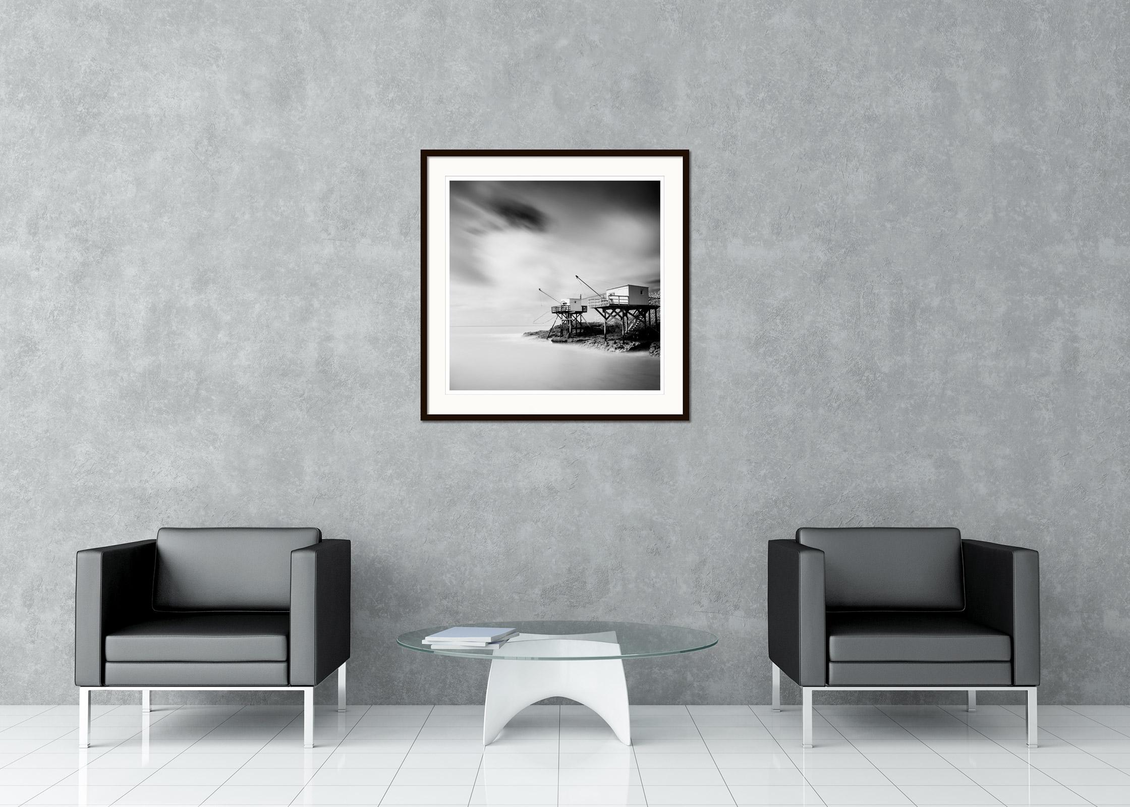 Black and white fine art long exposure waterscape - landscape photography print. Fishing stilt houses on the stormy Atlantic coast of France. Archival pigment ink print, edition of 9. Signed, titled, dated and numbered by artist. Certificate of