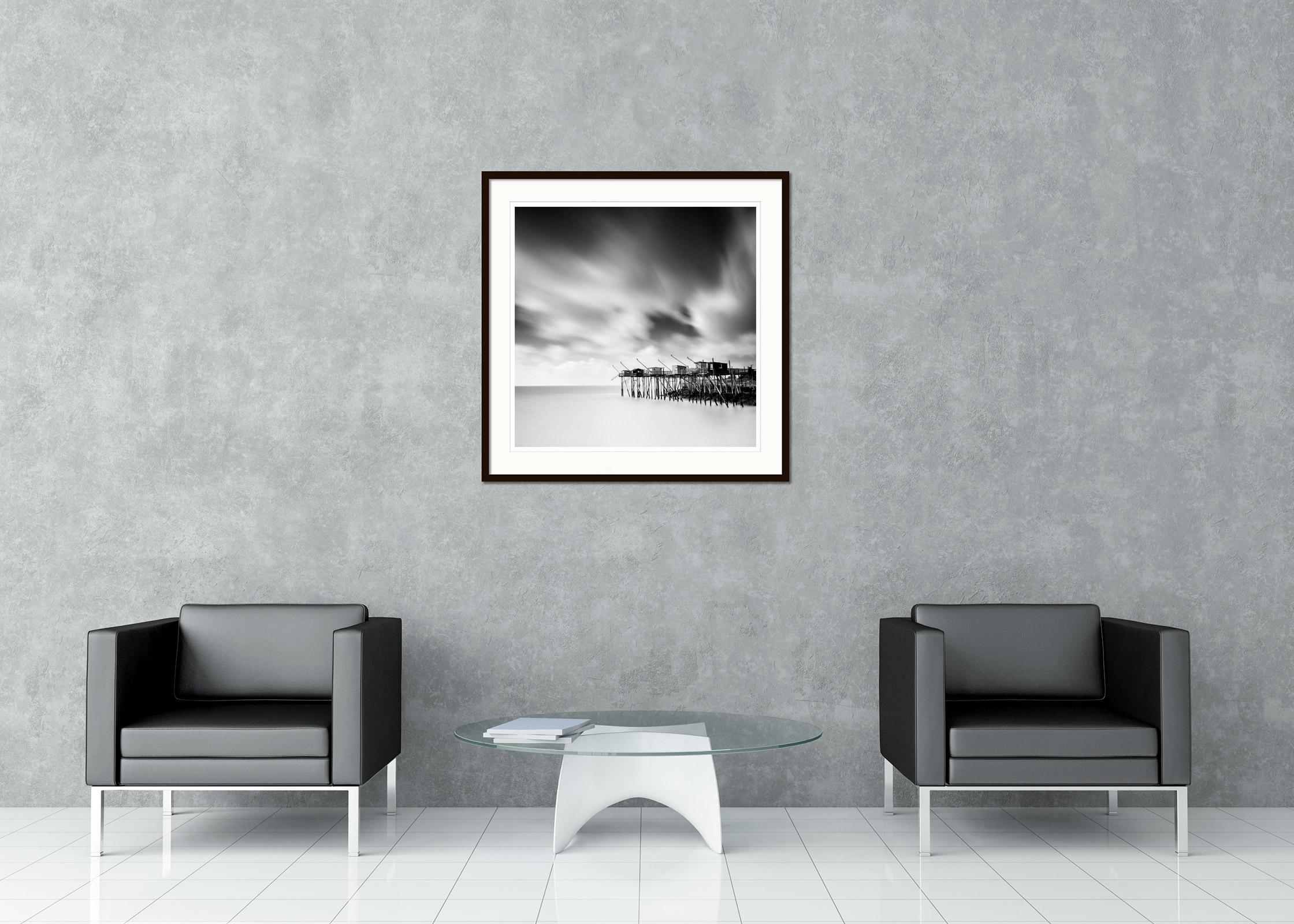 Black and white fine art long exposure seascape - landscape photography. Stilt houses on the wild French Atlantic coast during stormy weather. Archival pigment ink print, edition of 9. Signed, titled, dated and numbered by artist. Certificate of