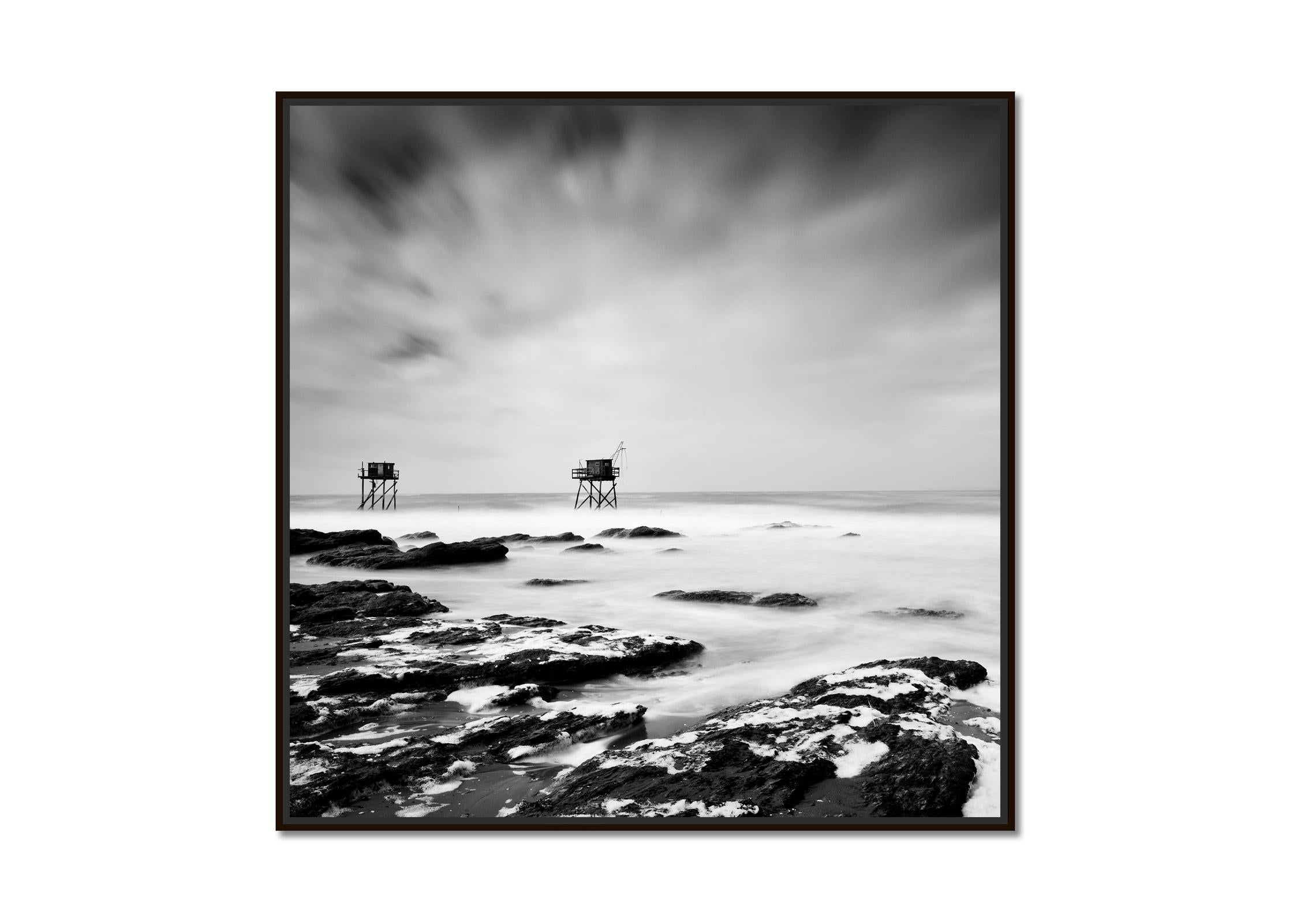 Fishing Hut on Stilts, coast of Atlantic Ocean, black and white waterscape - Photograph by Gerald Berghammer