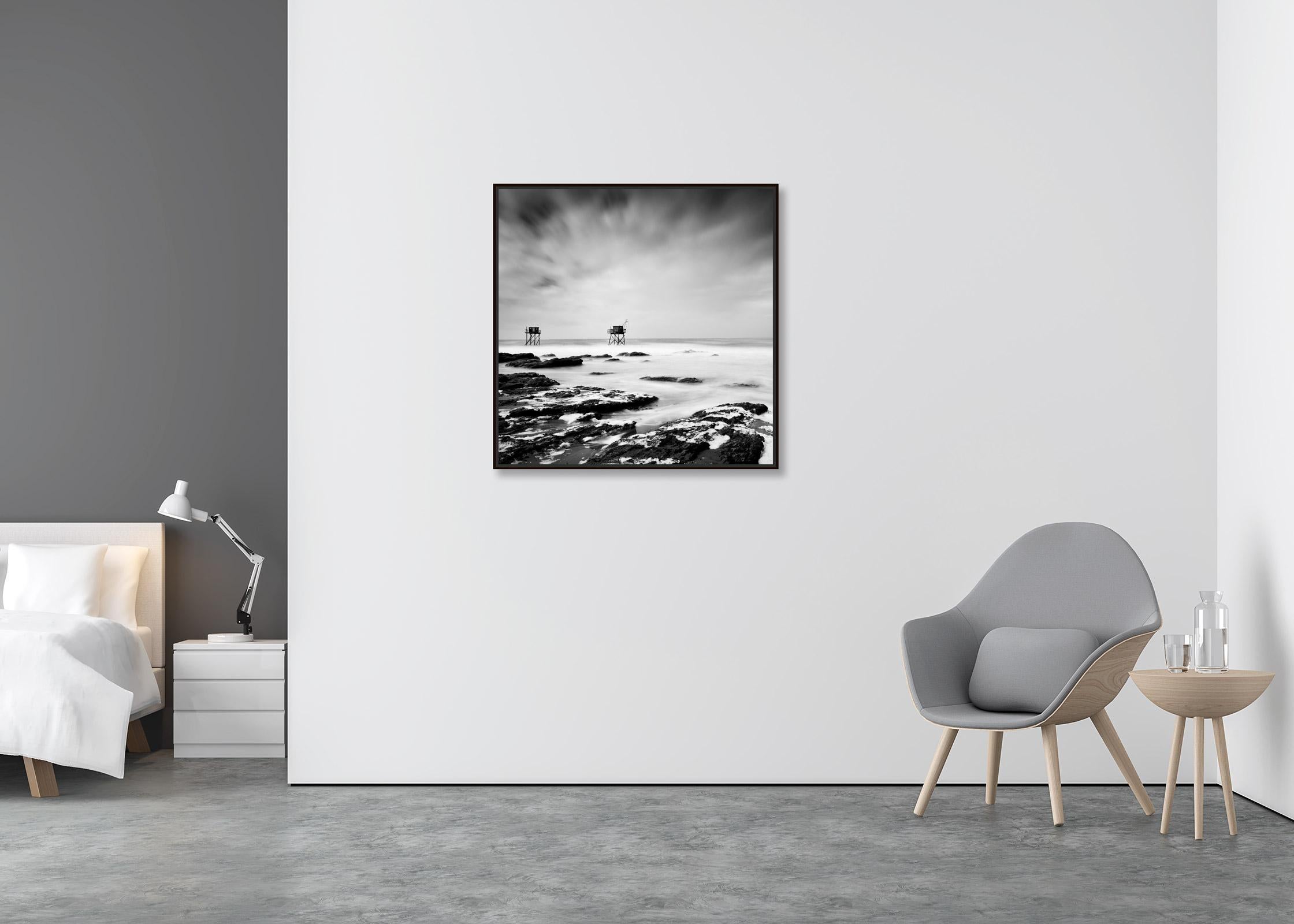 Fishing Hut on Stilts, coast of Atlantic Ocean, black and white waterscape - Contemporary Photograph by Gerald Berghammer