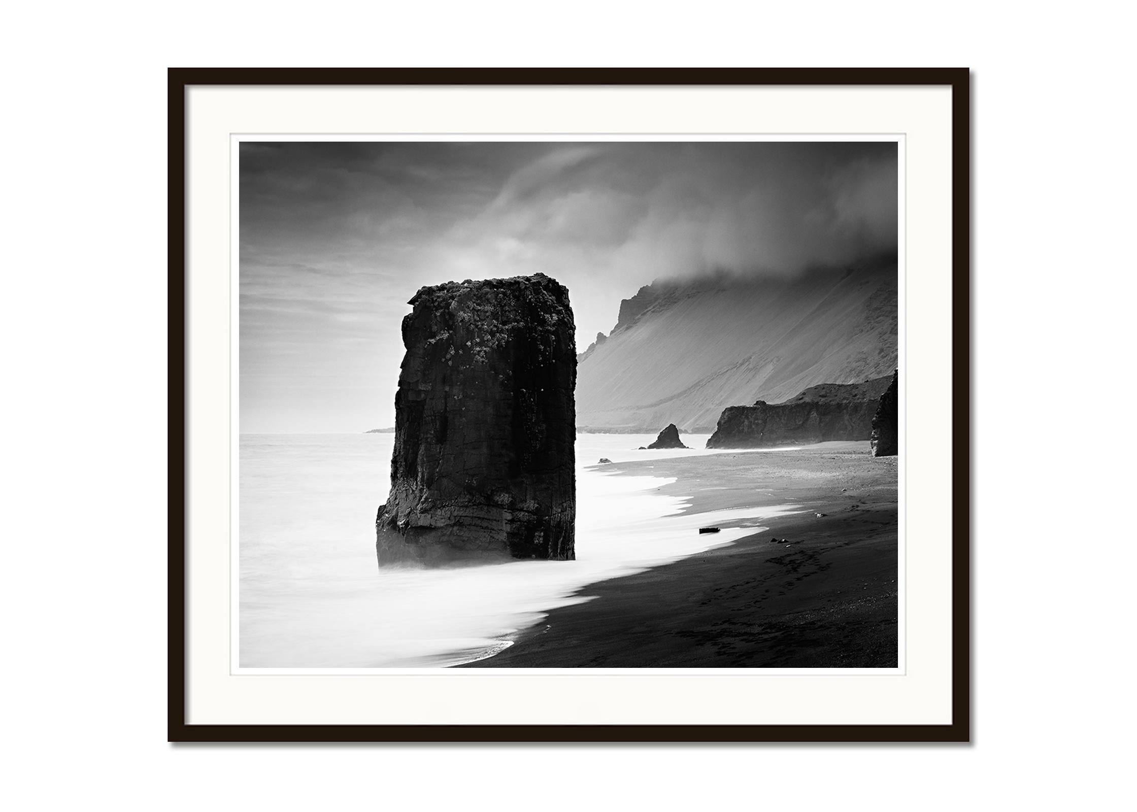 Flooded Rock, Black Beach, Iceland, black and white photography, landscape, art - Contemporary Photograph by Gerald Berghammer