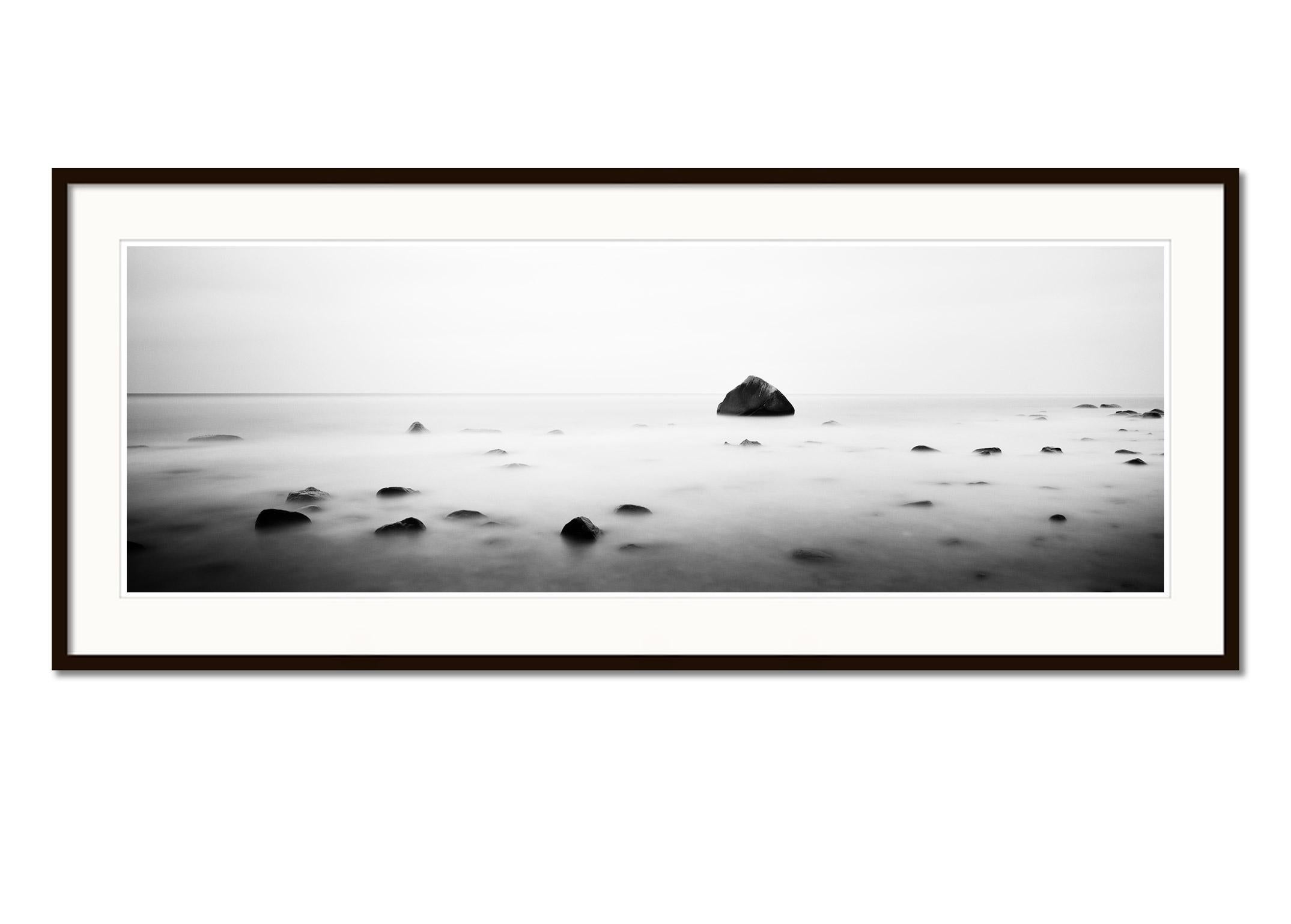 Black and white fine art panorama long exposure landscape - waterscape photography print. Glacial Erratic, Schwanenstein, Lohme, Rügen, Germany. Archival pigment ink print, edition of 9. Signed, titled, dated and numbered by artist. Certificate of