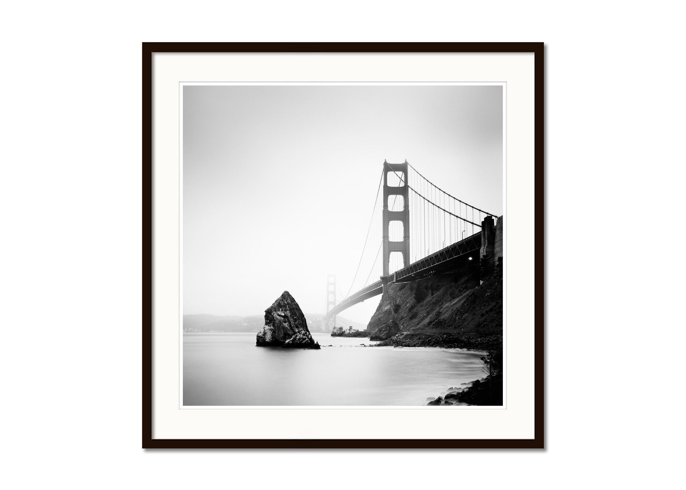 Golden Gate Bridge, fort point rock, San Francisco, b&w landscape photography - Gray Black and White Photograph by Gerald Berghammer