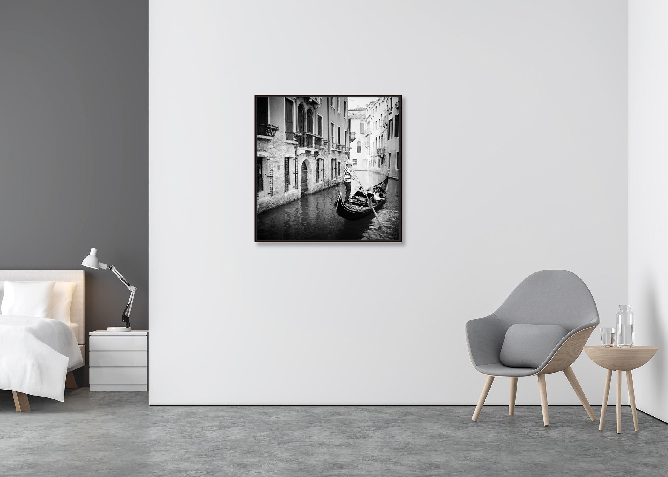 Gondoliere, Gondola, Canal, Venice, black and white art cityscape photography - Contemporary Photograph by Gerald Berghammer