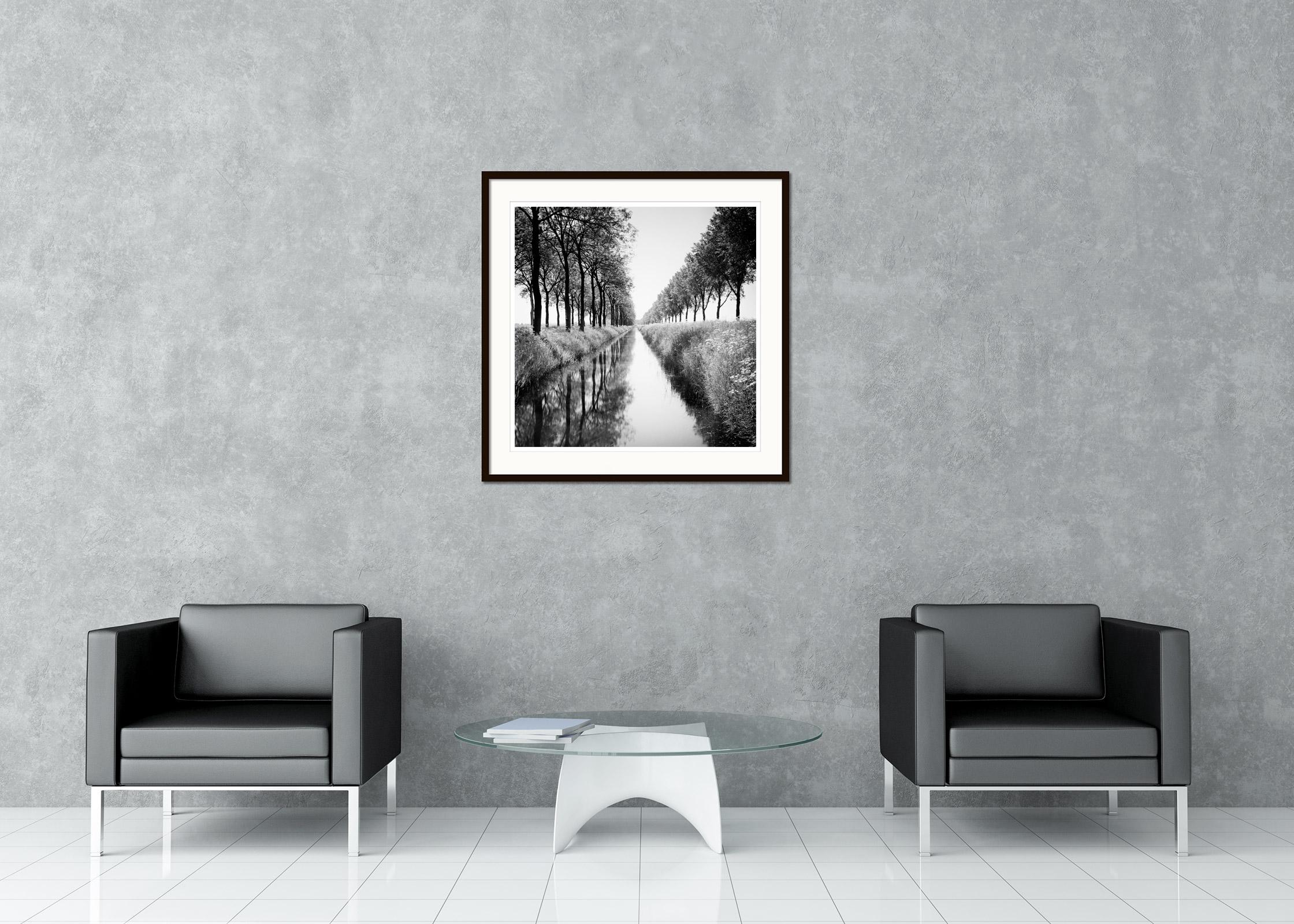 Black and White Fine Art Waterscape Photography - Avenue of trees by a water ditch with reflections in the calm water. Archival pigment ink print, edition of 9. Signed, titled, dated and numbered by artist. Certificate of authenticity included.