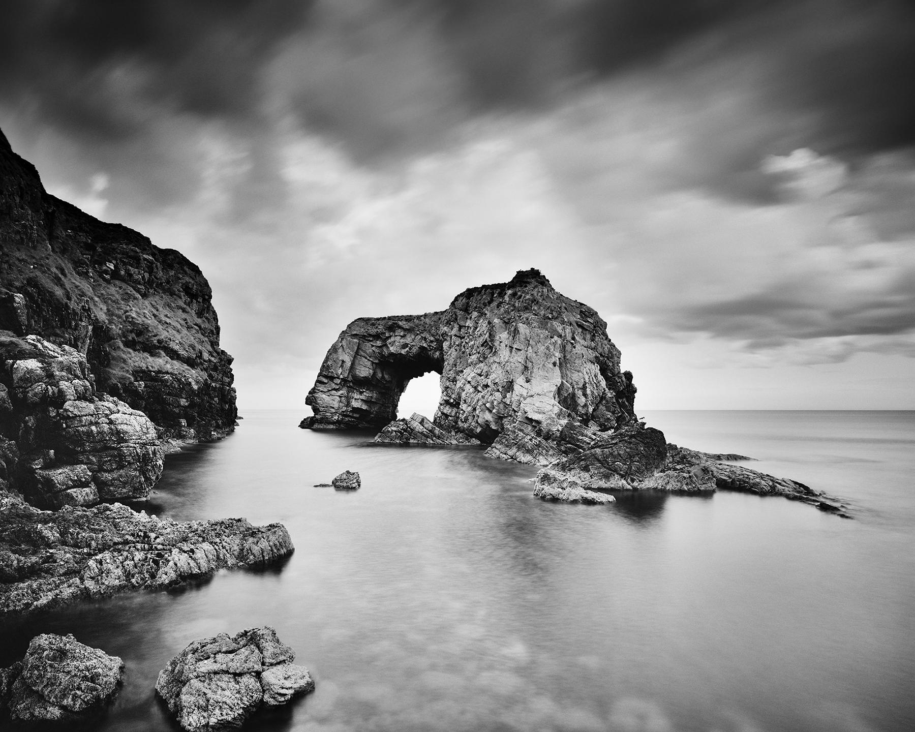 Gerald Berghammer Landscape Photograph - Great Pollet Sea Arch, Ireland, black and white fine art waterscape photography 