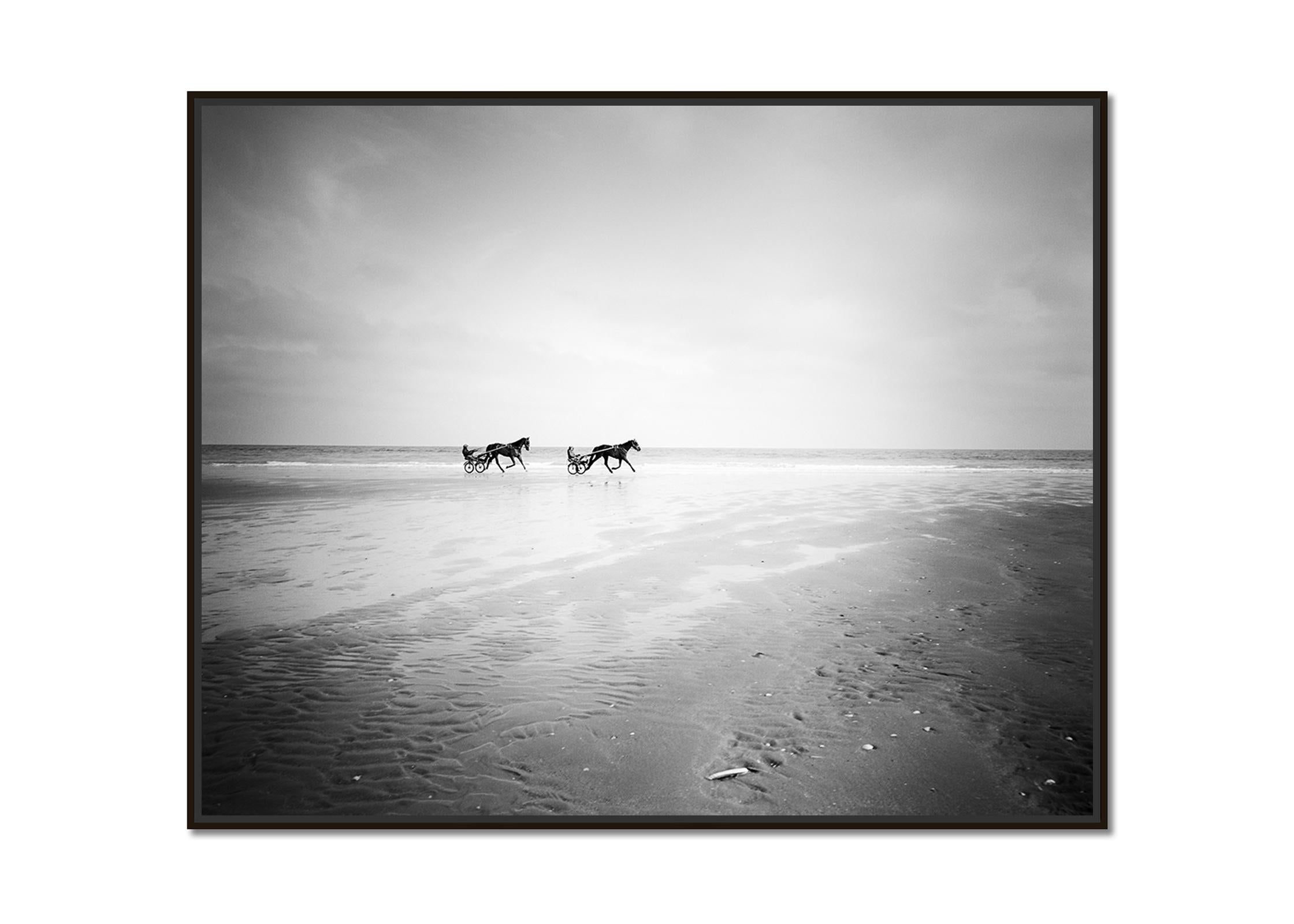Harness Racing, horse riding, beach, black and white photography, landscape - Photograph by Gerald Berghammer