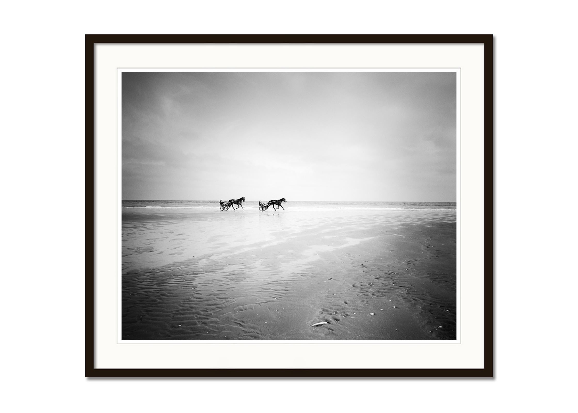 Harness Racing, horse riding, beach, black and white photography, landscape - Gray Black and White Photograph by Gerald Berghammer