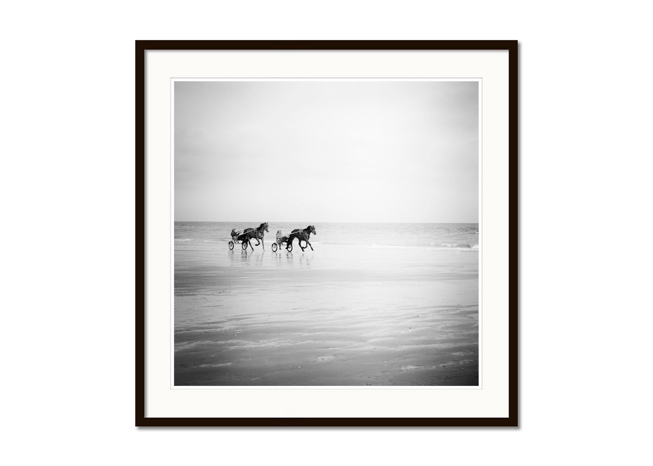 Harness Racing, horses on the beach, France, black white landscape photography - Gray Landscape Photograph by Gerald Berghammer
