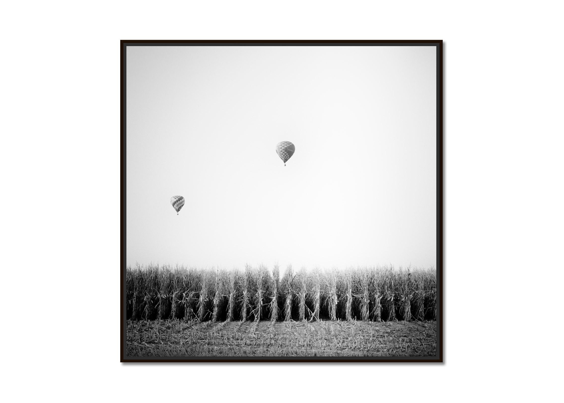 Hot Air Balloon, Cornfield, Championship, black and white landscape photo print - Photograph by Gerald Berghammer