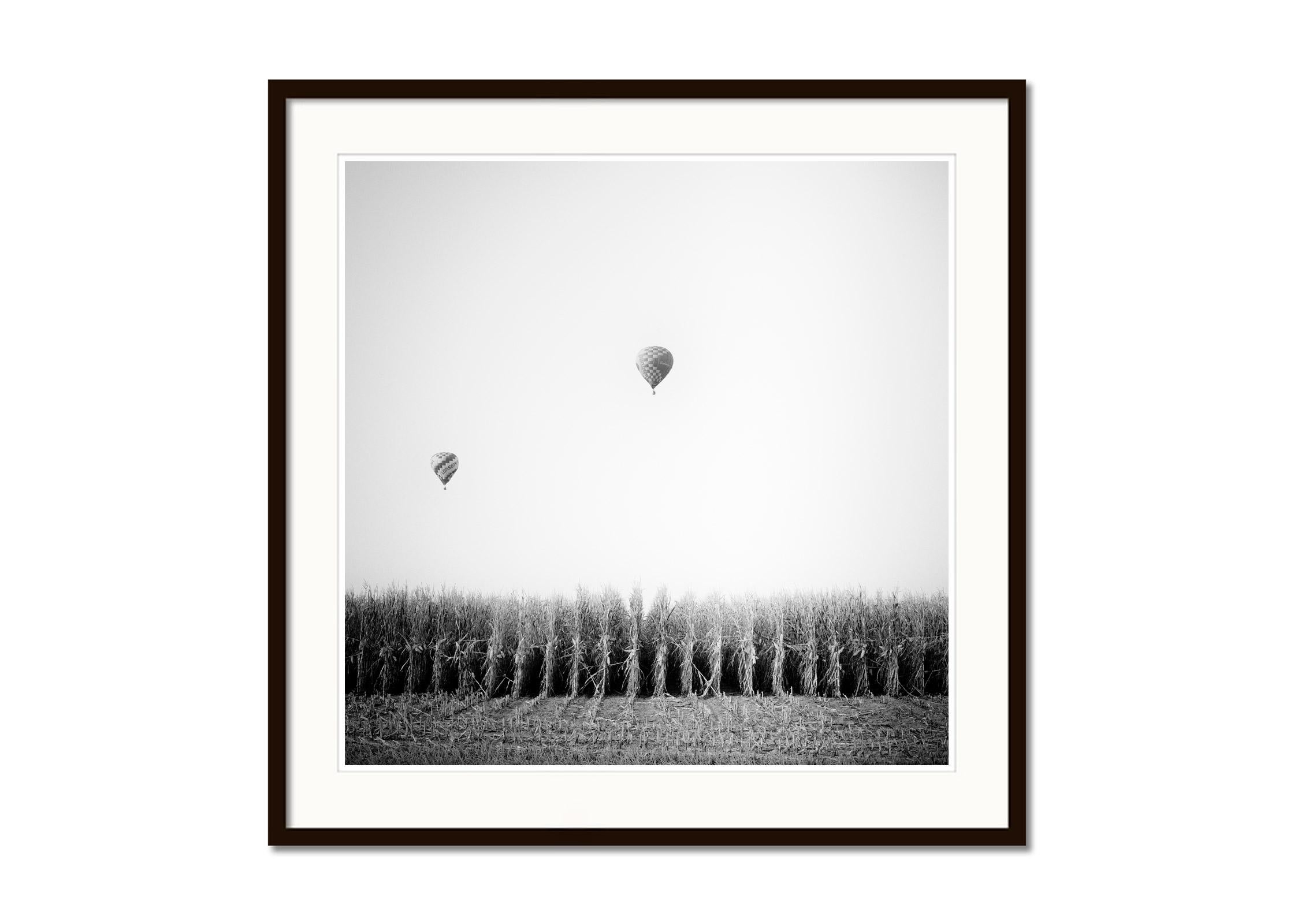 Hot Air Balloon, Cornfield, Championship, black and white landscape photo print - Gray Black and White Photograph by Gerald Berghammer