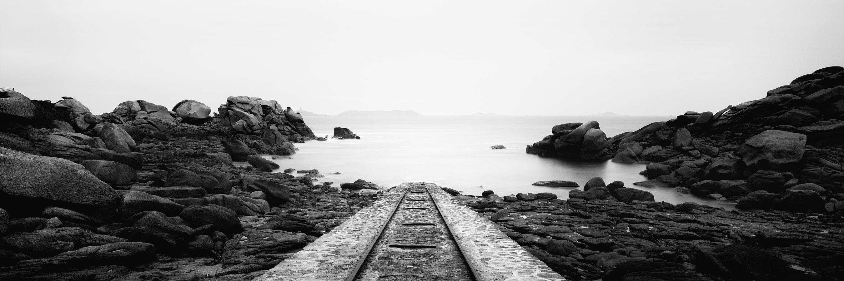 Gerald Berghammer Landscape Photograph - Into the Ocean railroad Atlantic bay France black white landscape photography