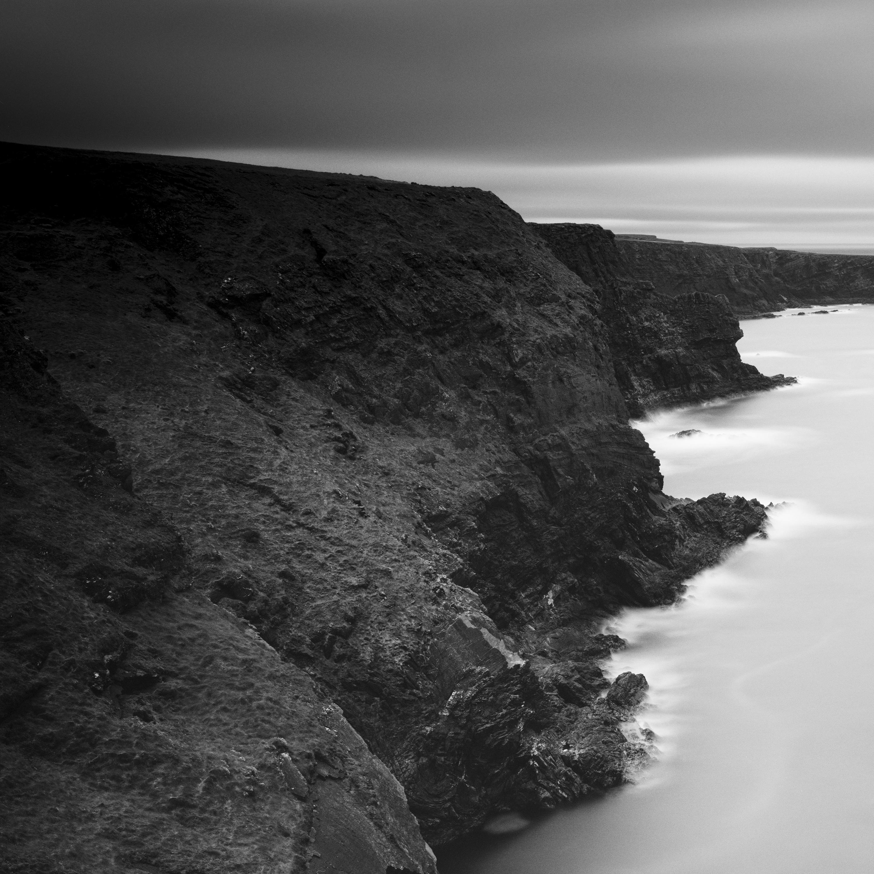 Black and White Fine Art Photography - Impressive coastal panorama of the cliffs of Ireland with small islands. Archival pigment ink print, edition of 9. Signed, titled, dated and numbered by artist. Certificate of authenticity included. Printed