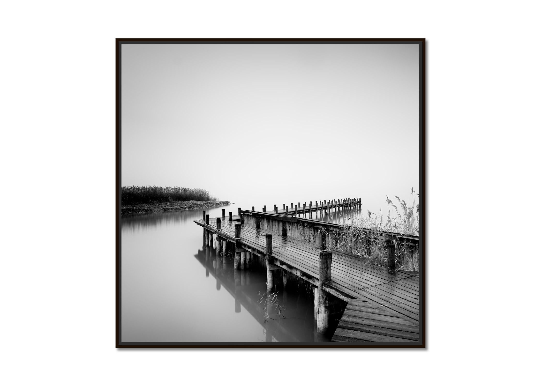 Jetty on calm Lake, foggy morning, black and white, long exposure art waterscape - Photograph by Gerald Berghammer