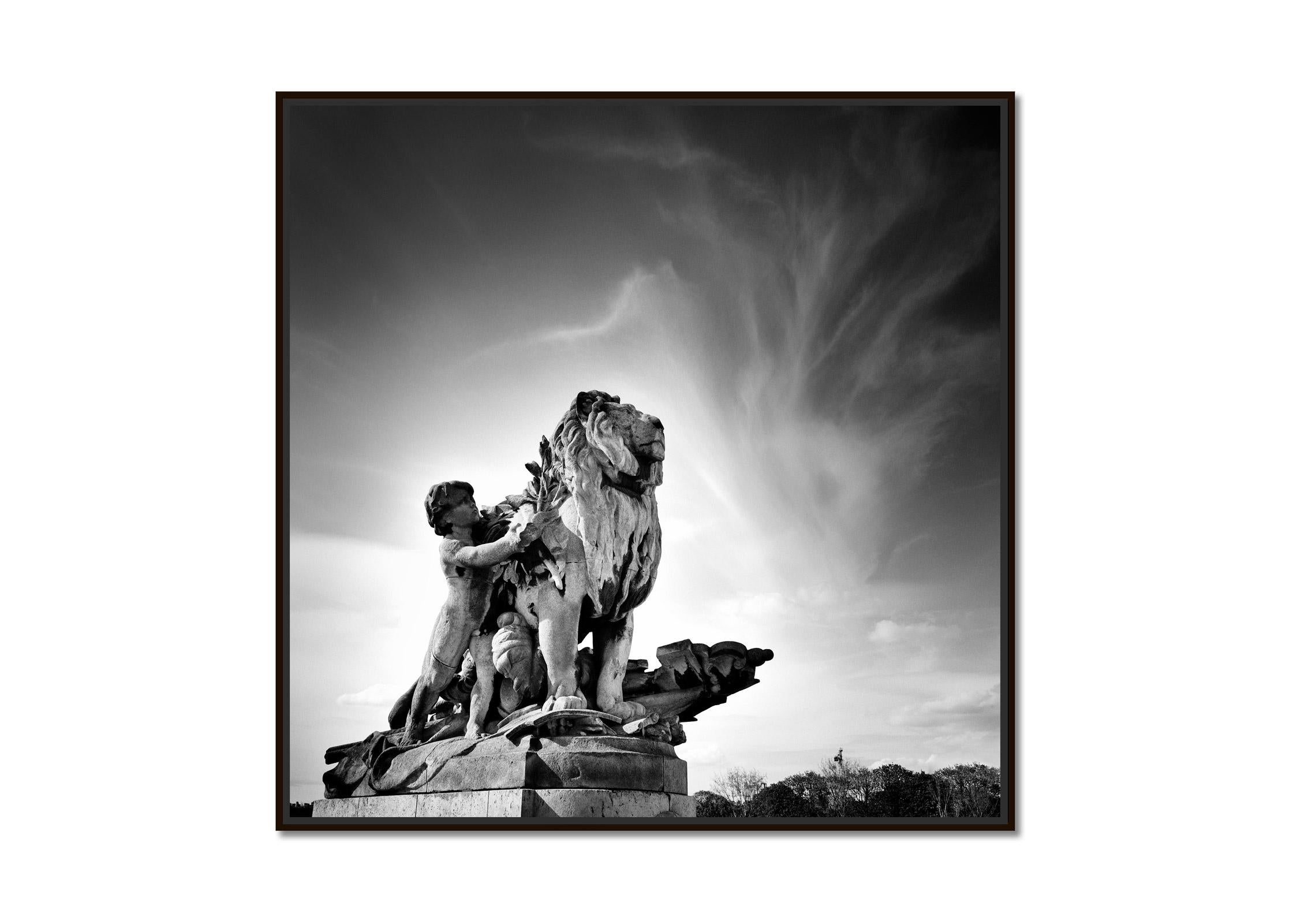 Lion a l'Enfant Statue, Pont Alexandre, Paris, black and white photography - Photograph by Gerald Berghammer