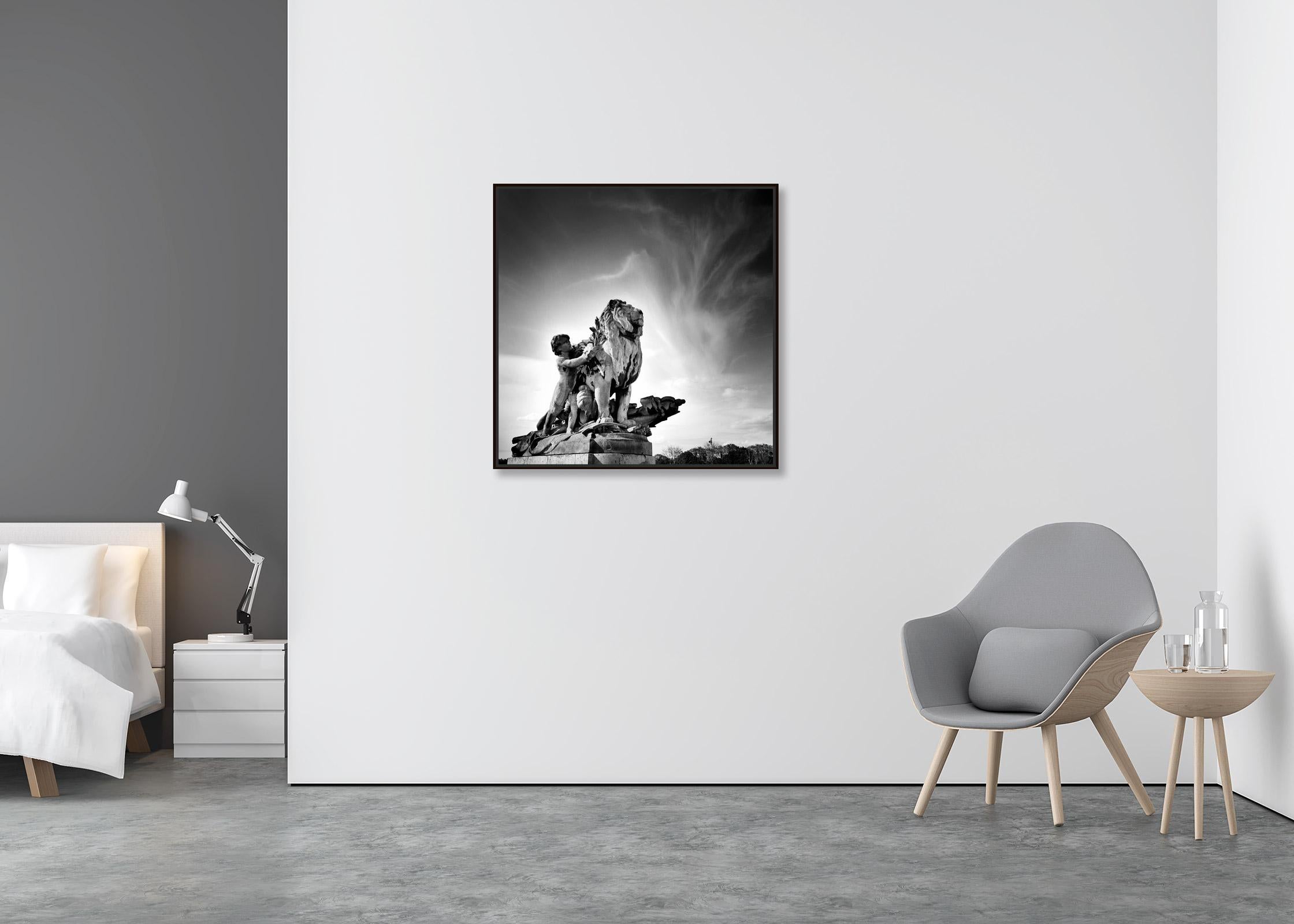 Lion a l'Enfant Statue, Pont Alexandre, Paris, black and white photography - Contemporary Photograph by Gerald Berghammer