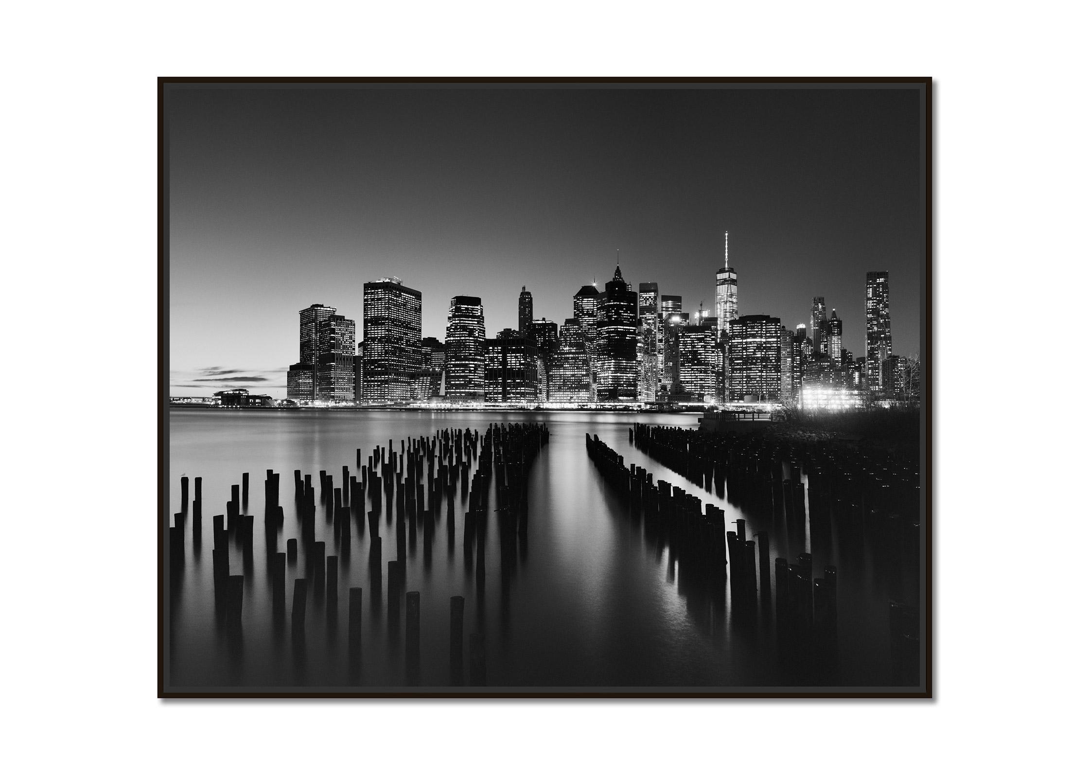 Manhattan Skyline, Night New York City, black and white photography, landscape - Photograph by Gerald Berghammer