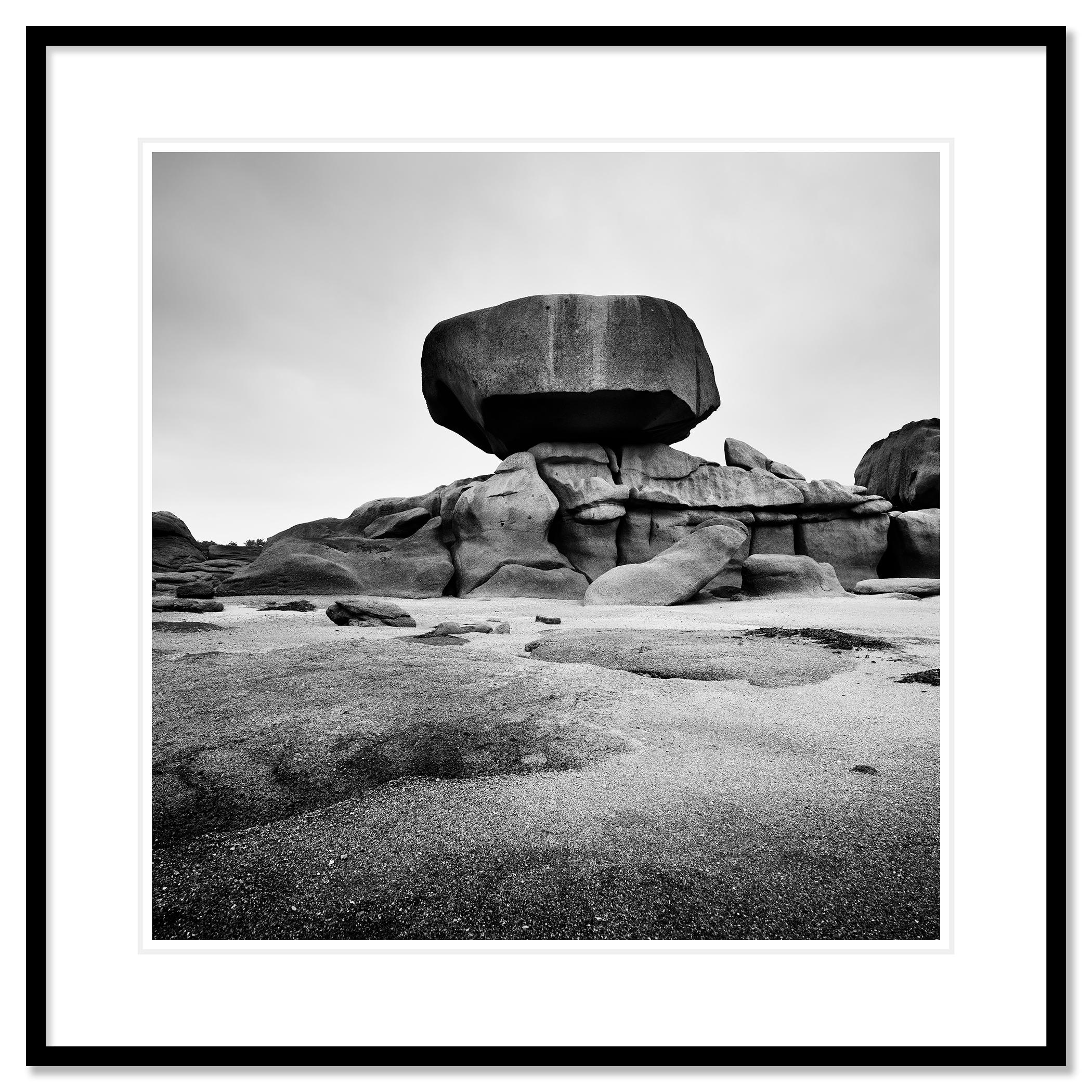 Black and white fine art landscape photography. Huge Rock on the pink granite coast beach in Brittany, France. Archival pigment ink print as part of a limited edition of 9. All Gerald Berghammer prints are made to order in limited editions on