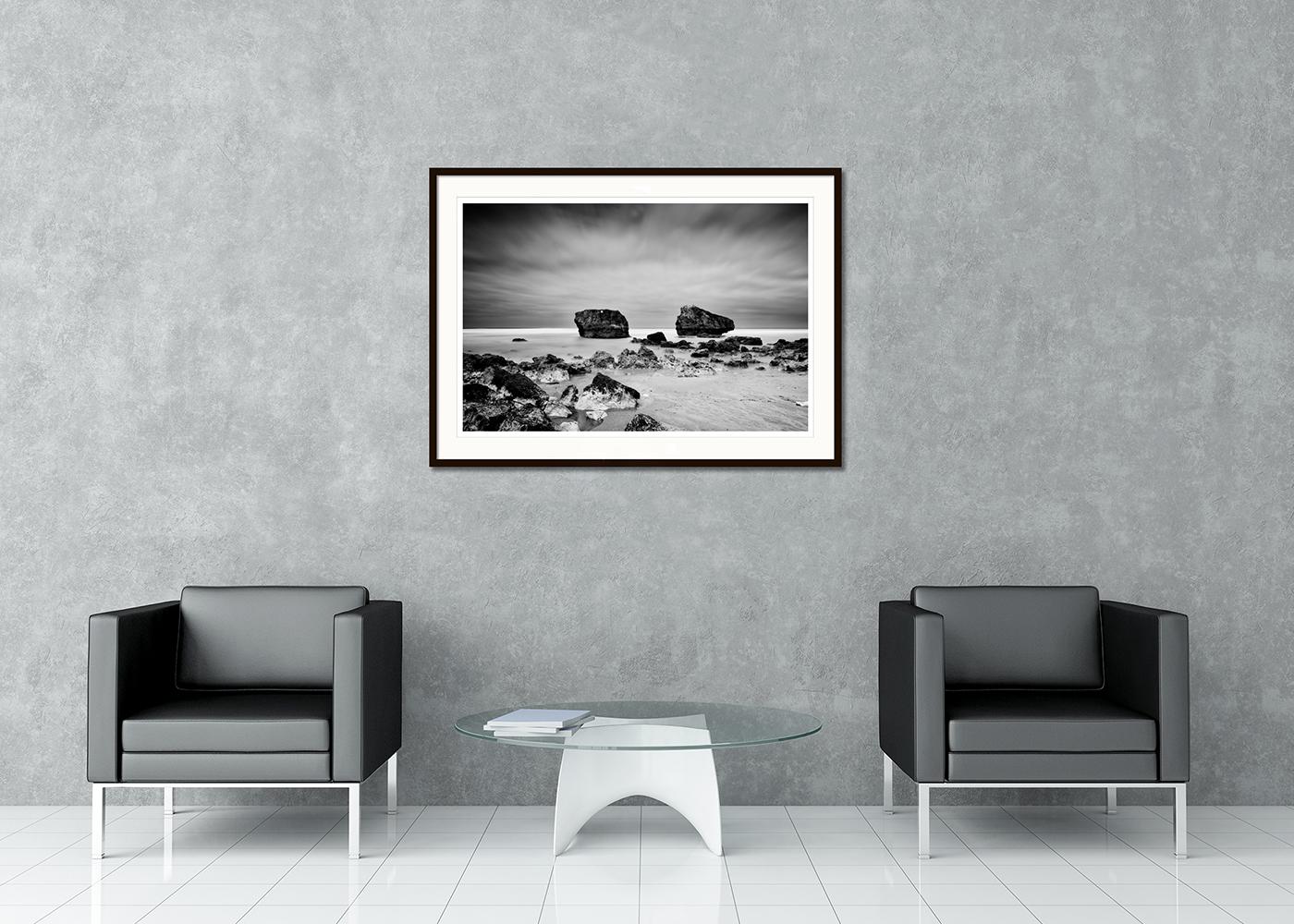 Black and white fine art long exposure waterscape - landscape photography. Giant rocks on the sandy beach of the Atlantic coast in France. Archival pigment ink print as part of a limited edition of 7. All Gerald Berghammer prints are made to order