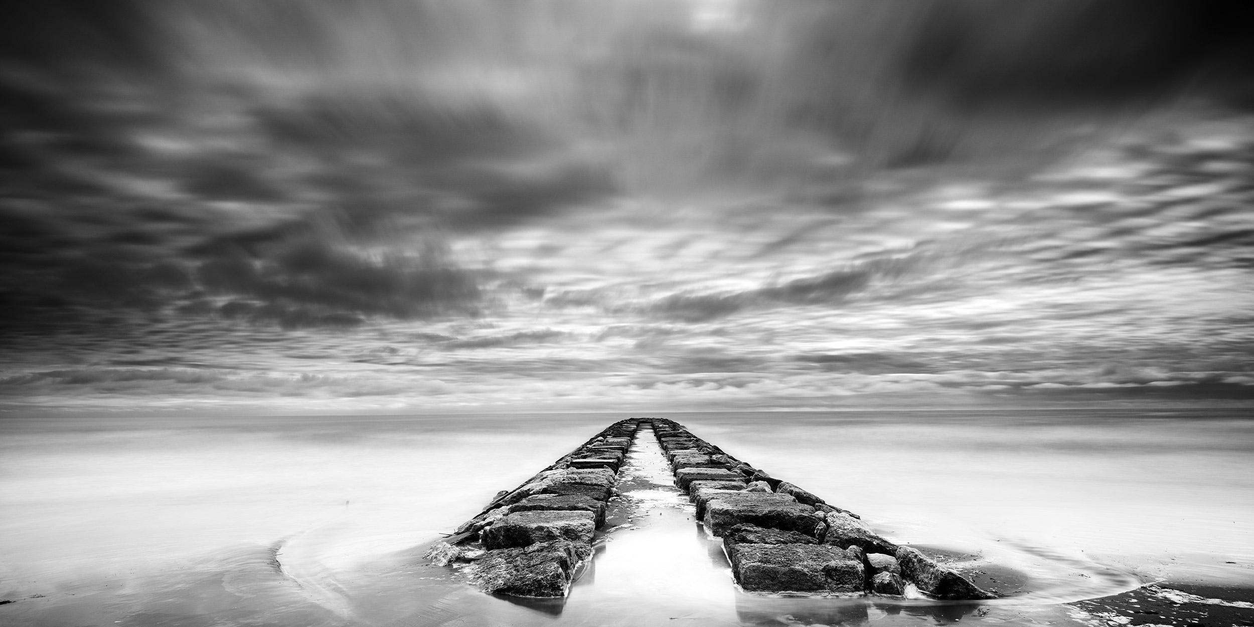 Gerald Berghammer Landscape Photograph - Rock Pier Panorama, stormy, cloudy, black white fine art photography, landscape